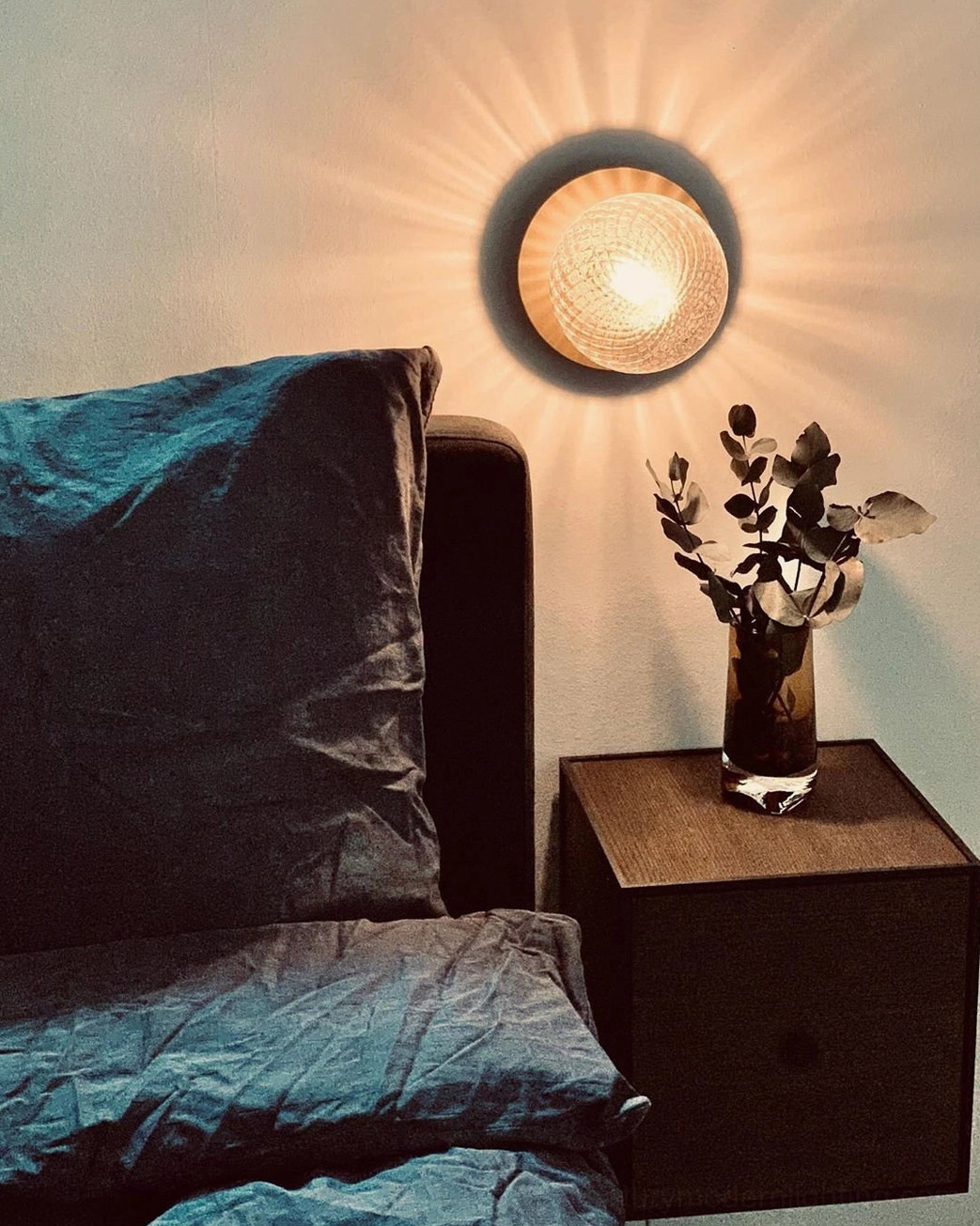 Lila mid-century modern sconce with Edison bulb creating vintage warm glow ambiance