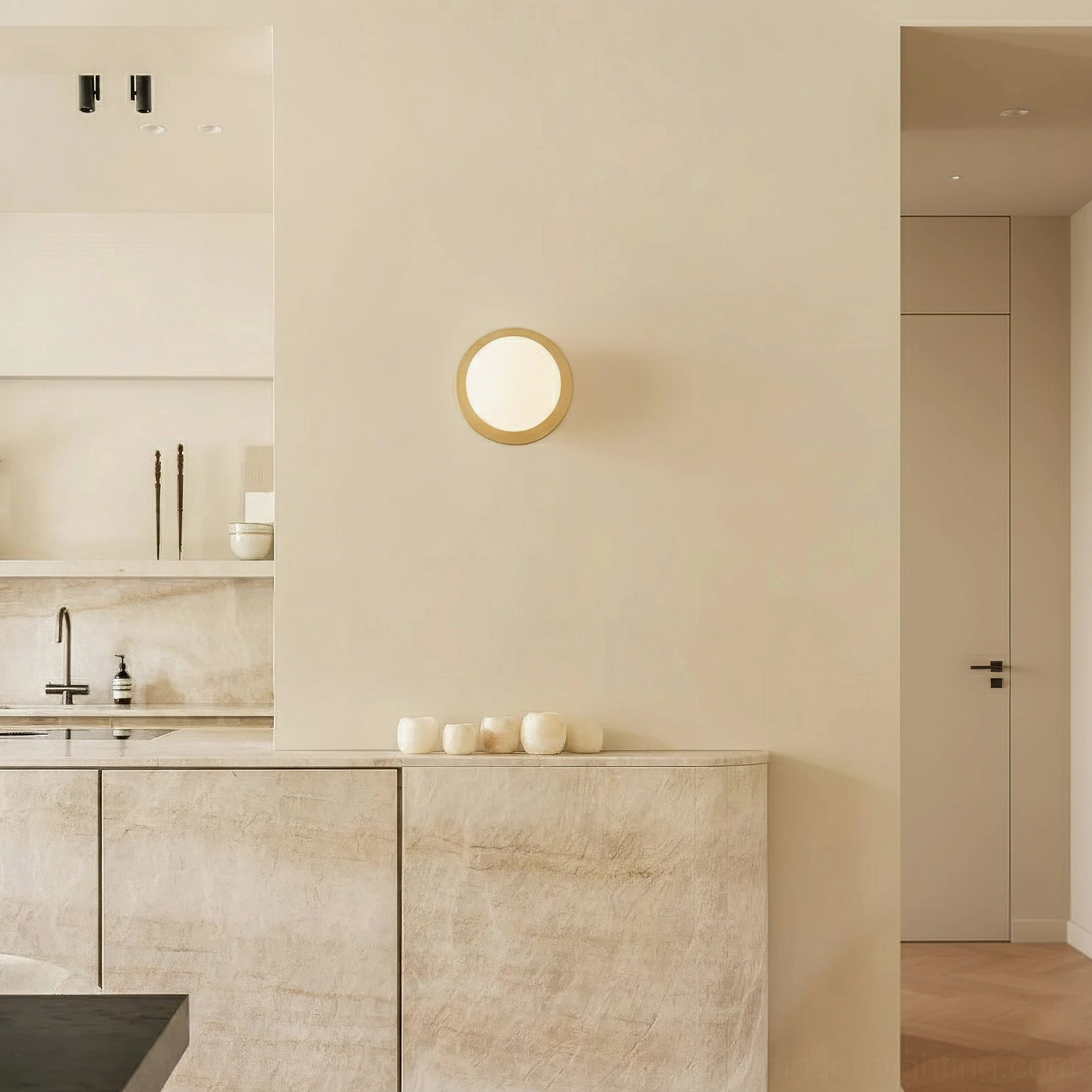 Lila mid-century modern sconce mounted in contemporary kitchen above marble countertop
