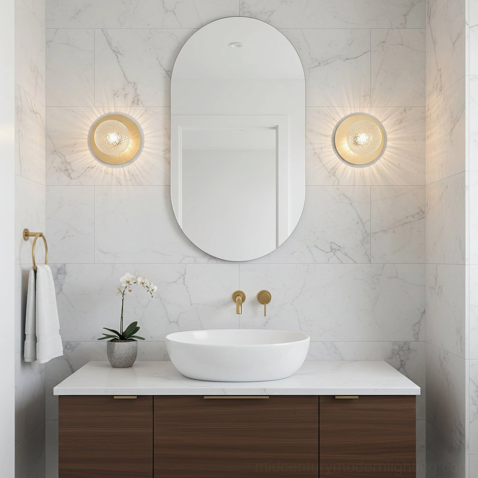 Pair of Lila brass sconces with frosted white glass mounted on luxury marble bathroom wall