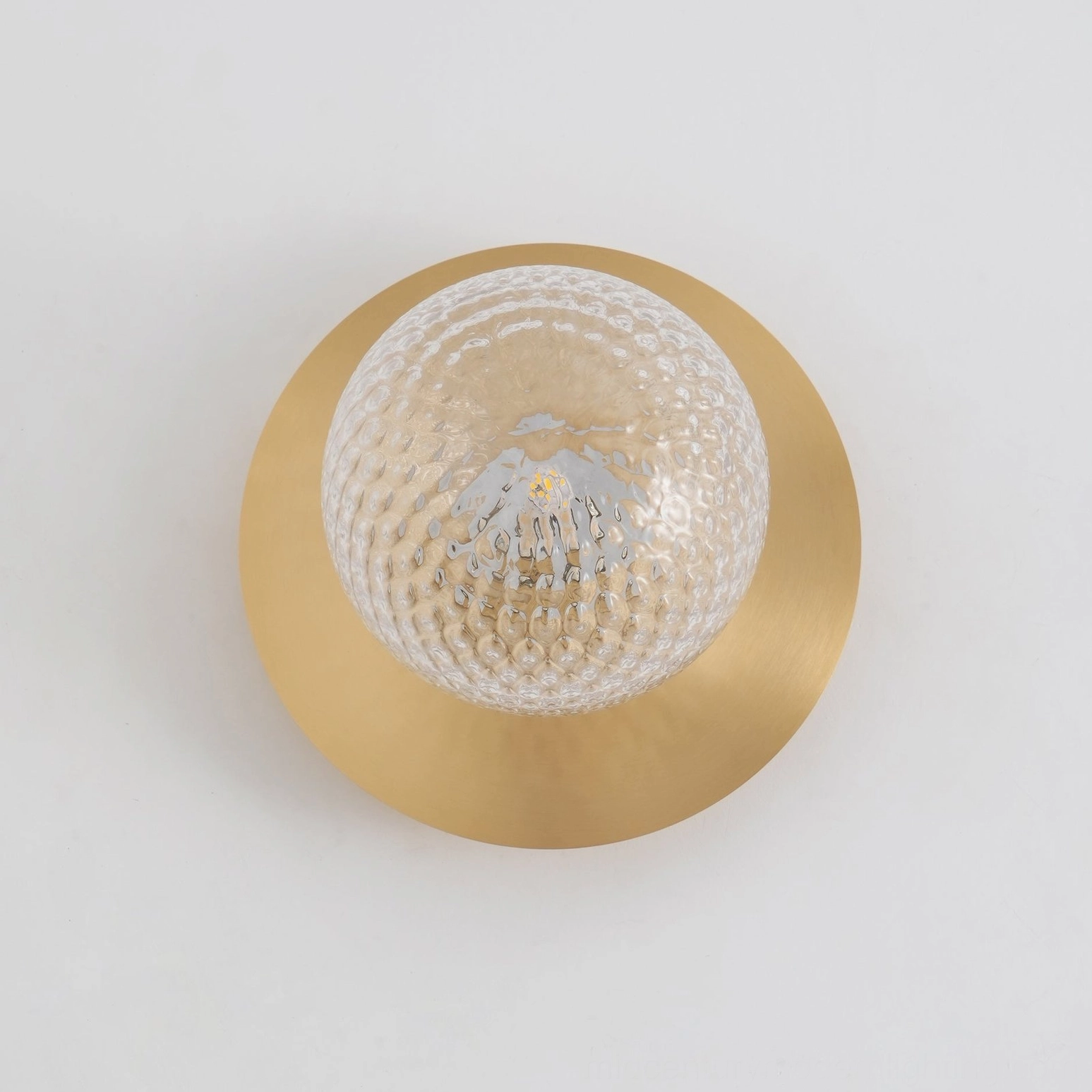Lila wall sconce product photography showing sphere and circular backplate design elements