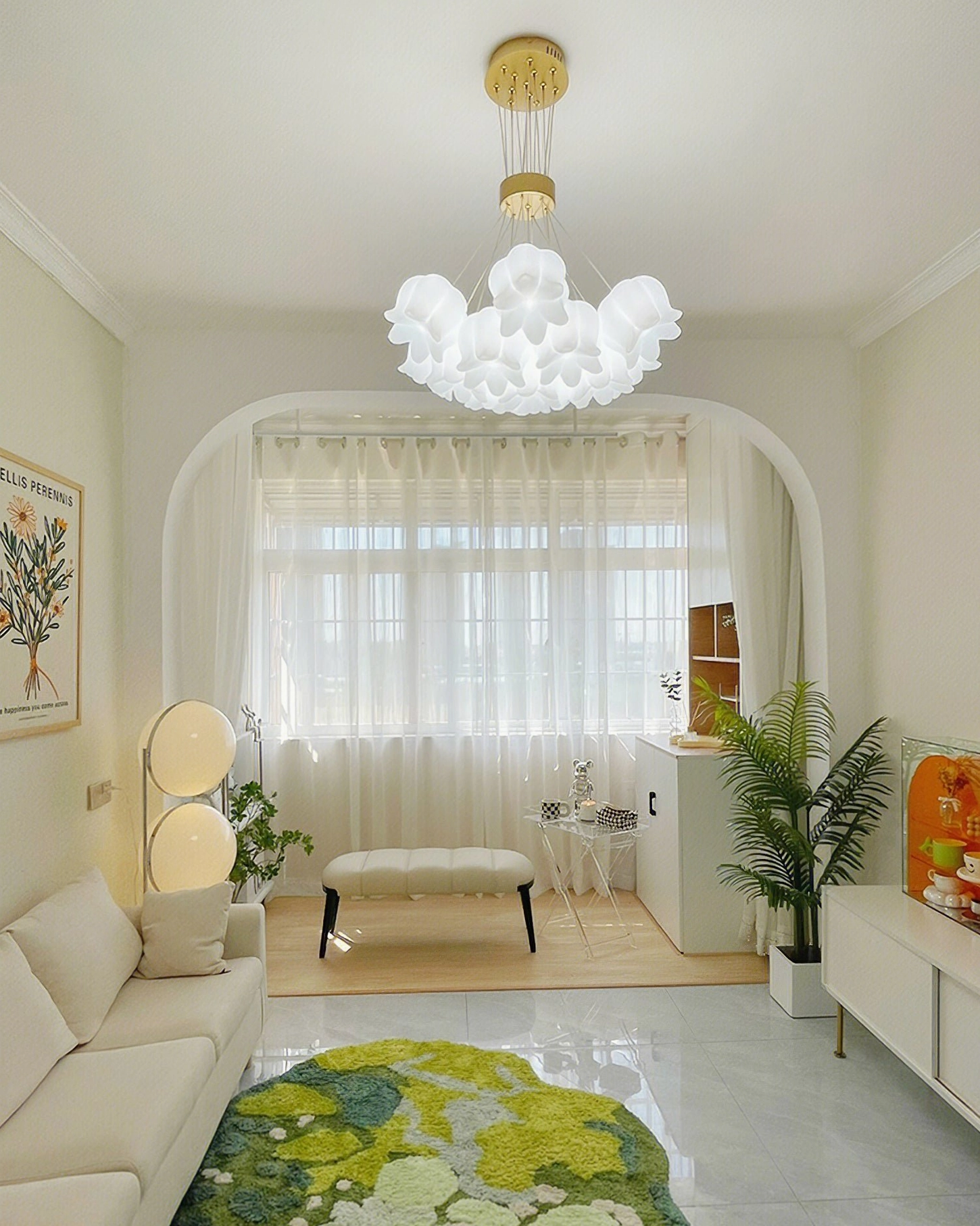 Mid-century modern lily of the valley chandelier in minimalist French creamy living room with arched doorway and warm lighting