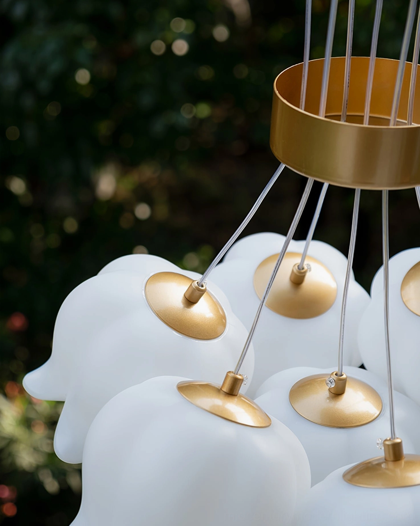 Lily of the valley chandelier multi-pendant cluster showing full sculptural arrangement and botanical aesthetic from side angle