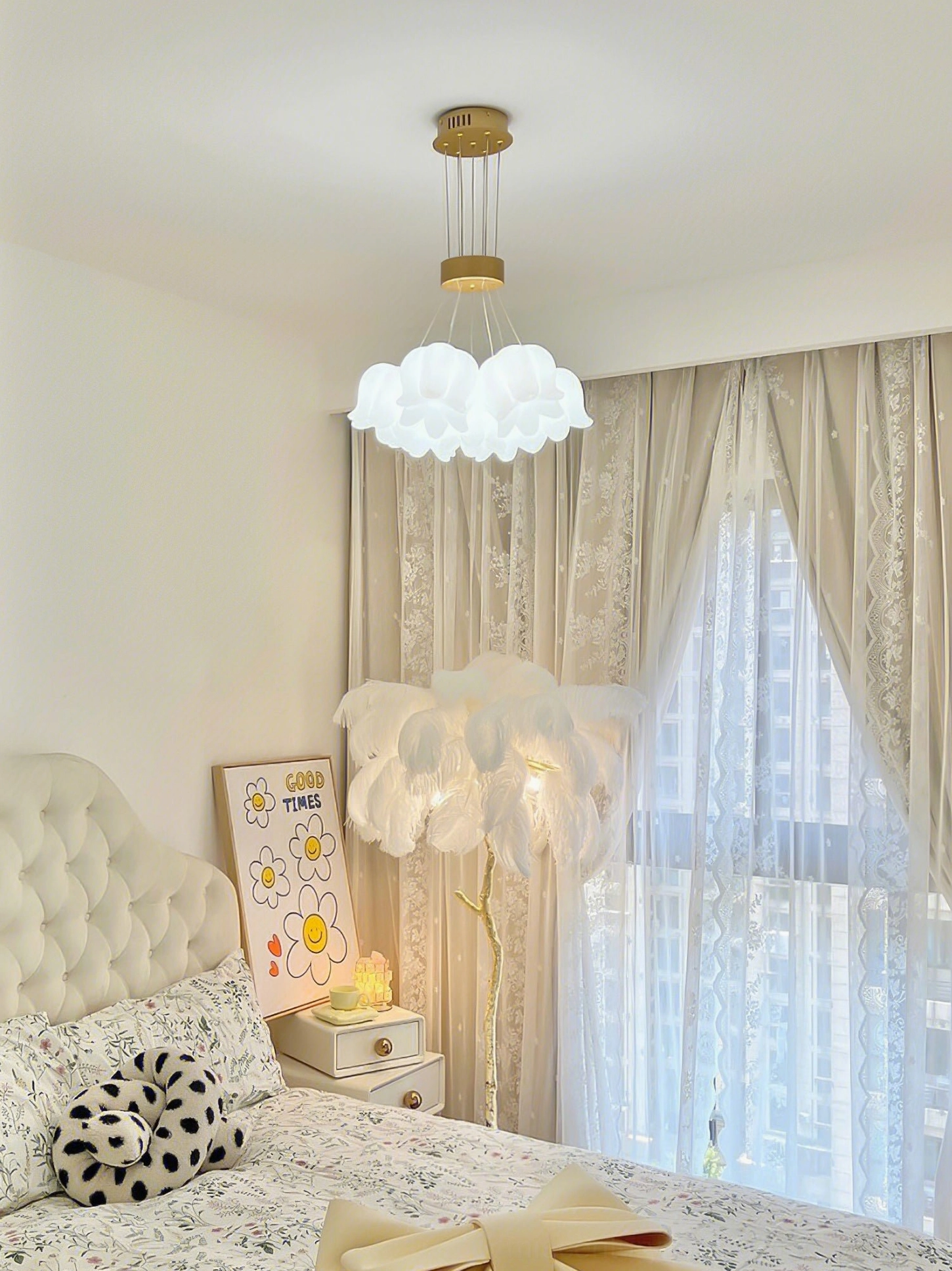 Flower-shaped frosted white acrylic pendant chandelier hanging in creamy bedroom with lace curtains and elegant decor