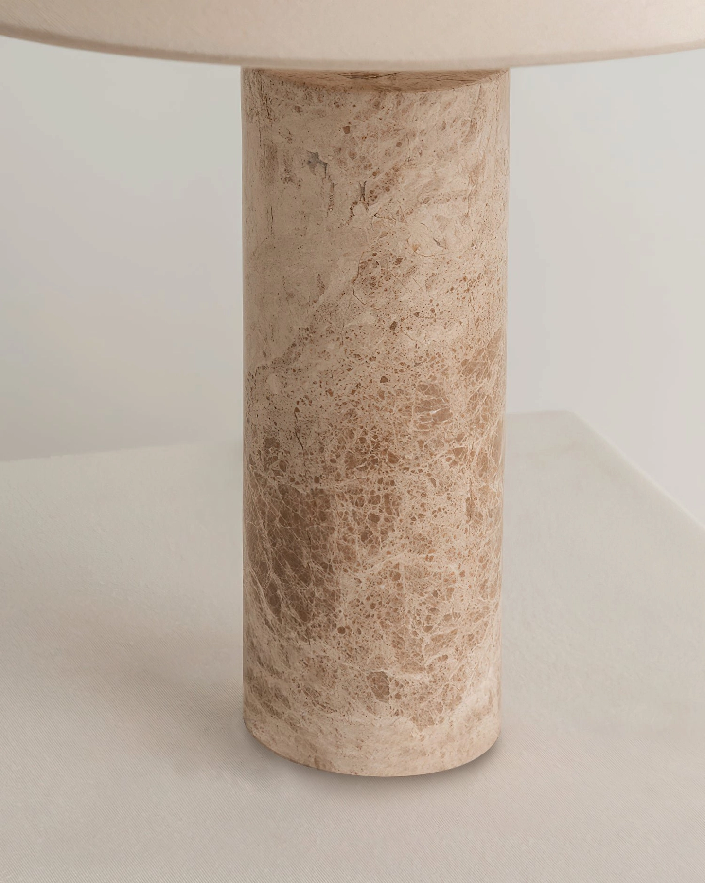 Limoges marble base close-up shot showing natural veining texture and stone detail minimalist design