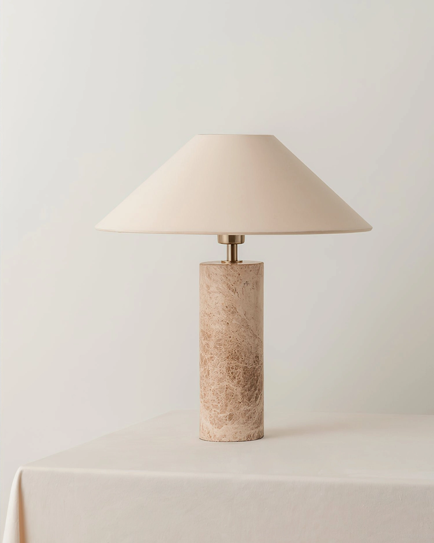 Limoges table lamp minimalist front view neutral warm studio setting fabric shade detail
