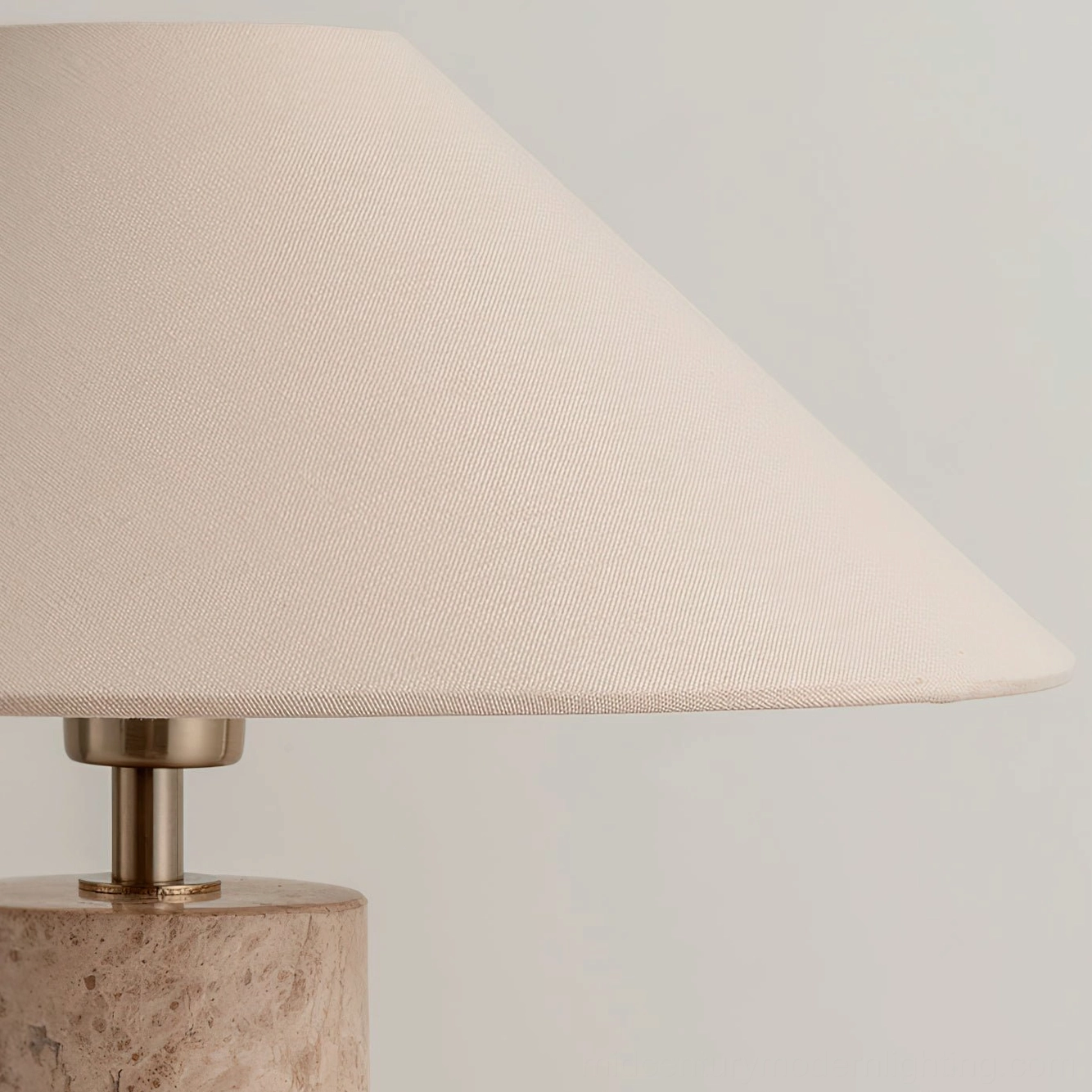 Limoges table lamp illuminated front view warm glowing neutral design white studio background