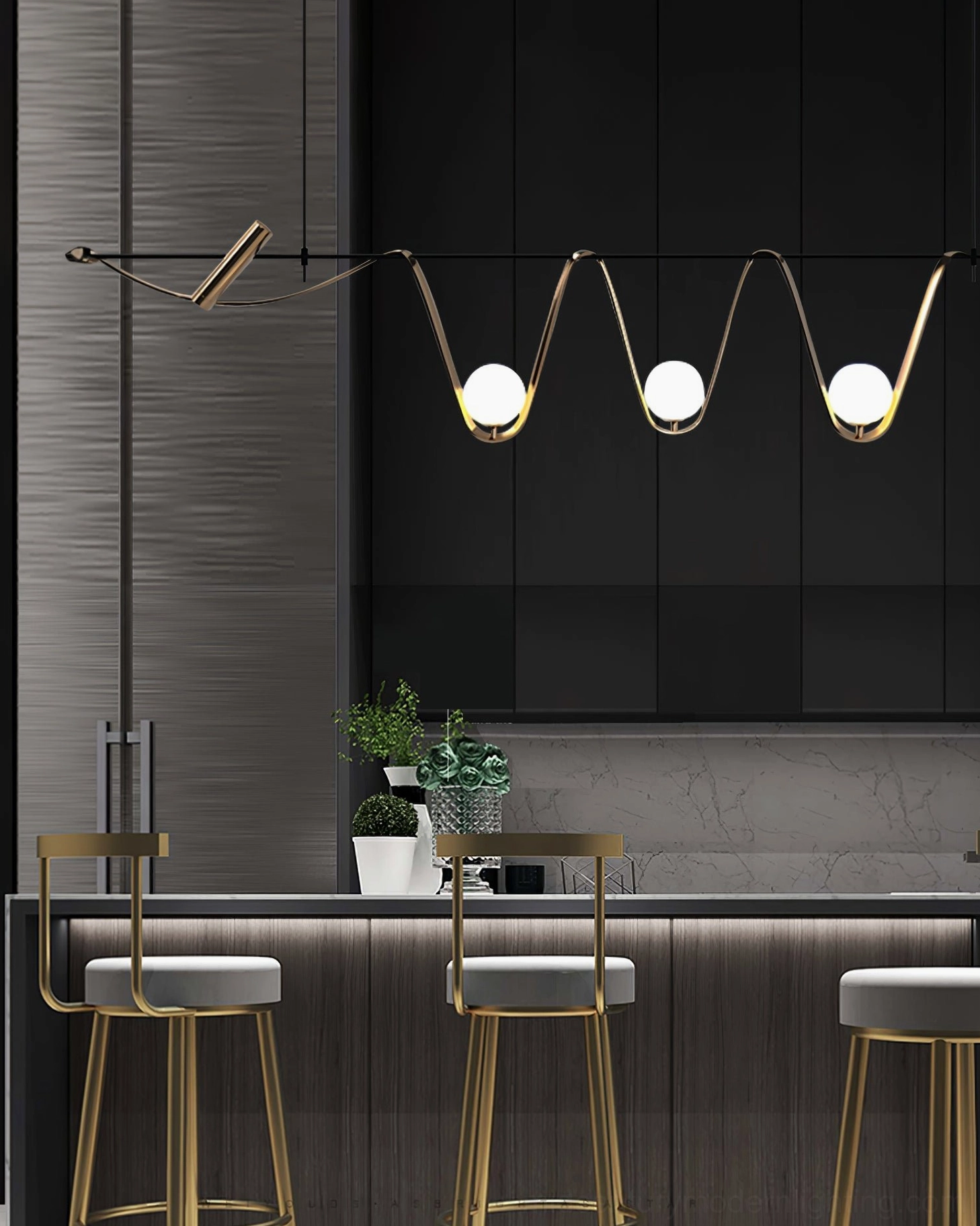 Linear island chandelier installed in modern dark kitchen bar area - warm luxury lighting for contemporary spaces
