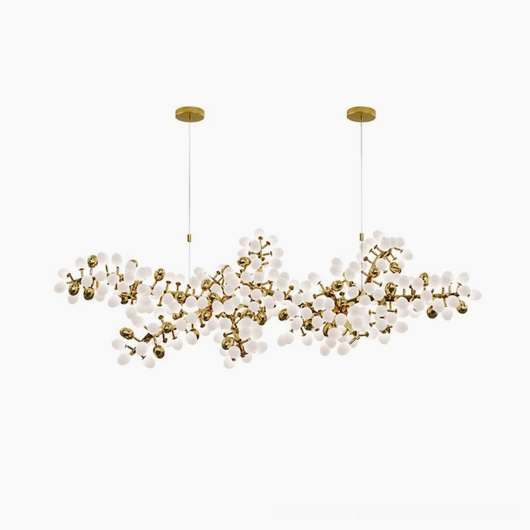 Linear grape vine chandelier 115 heads configuration over dining counter with warm lighting