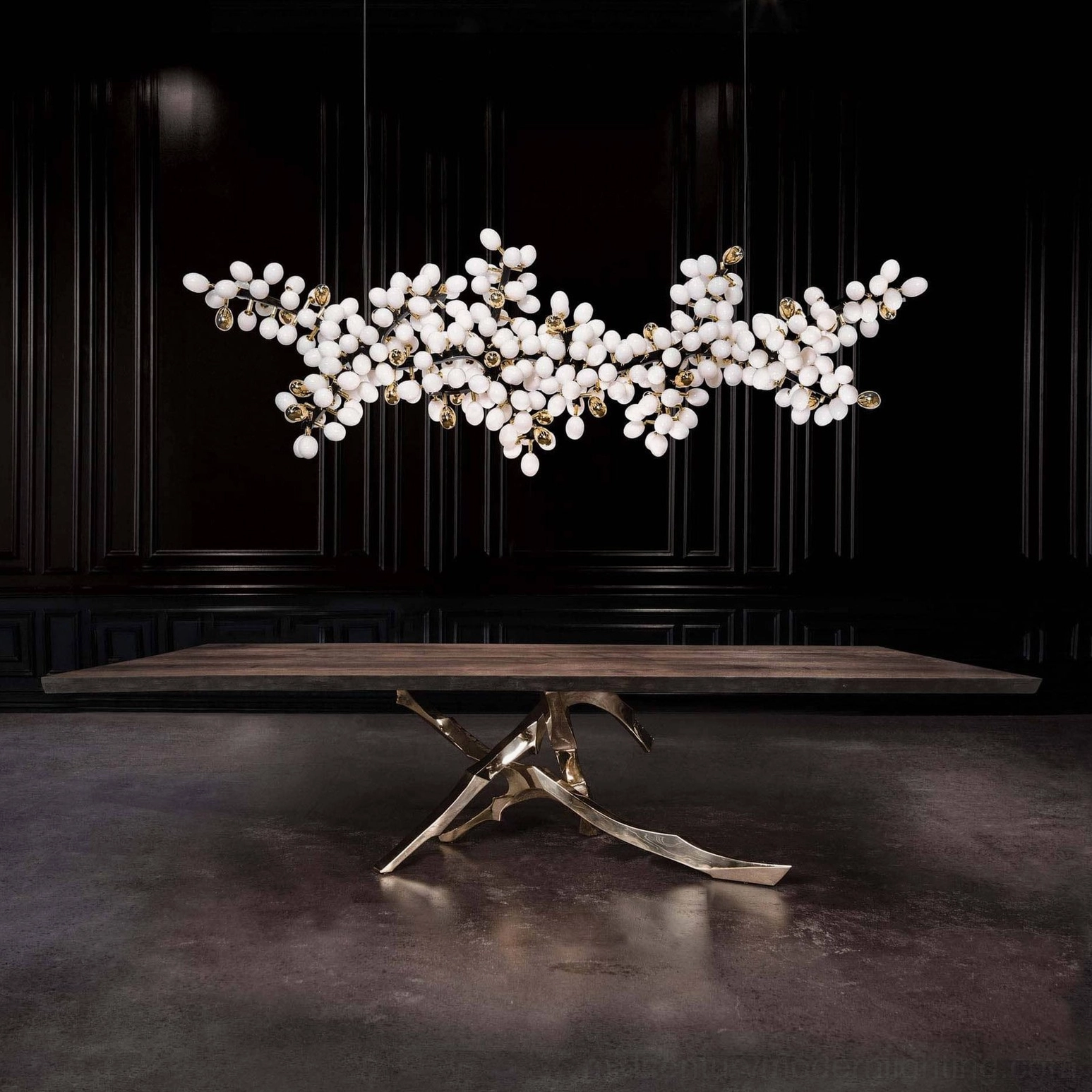 Linear grape vine chandelier with all-white frosted glass shades in dark moody dining room, minimalist modern design
