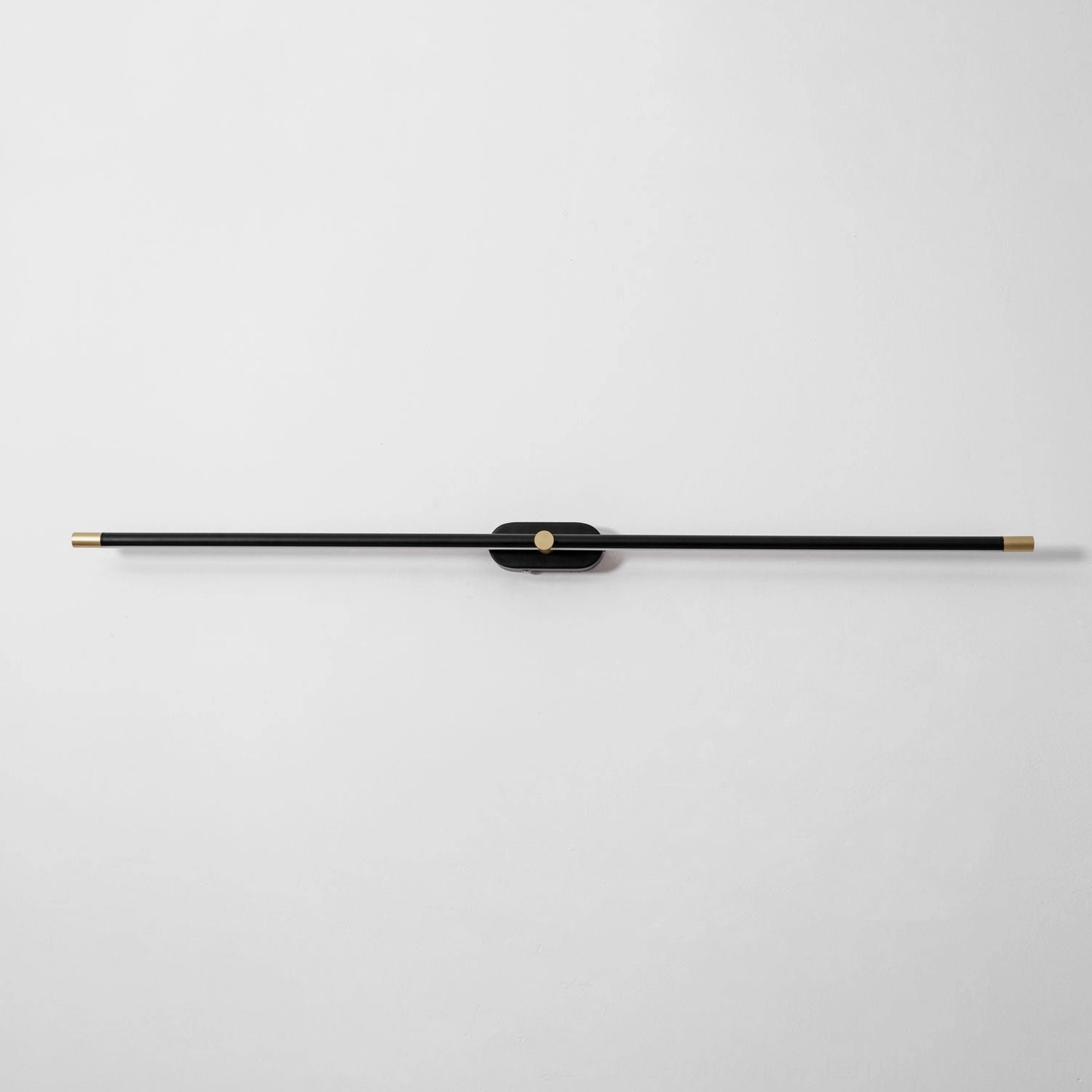 Modern linear rechargeable wall lamp installed in boutique retail space accent lighting design