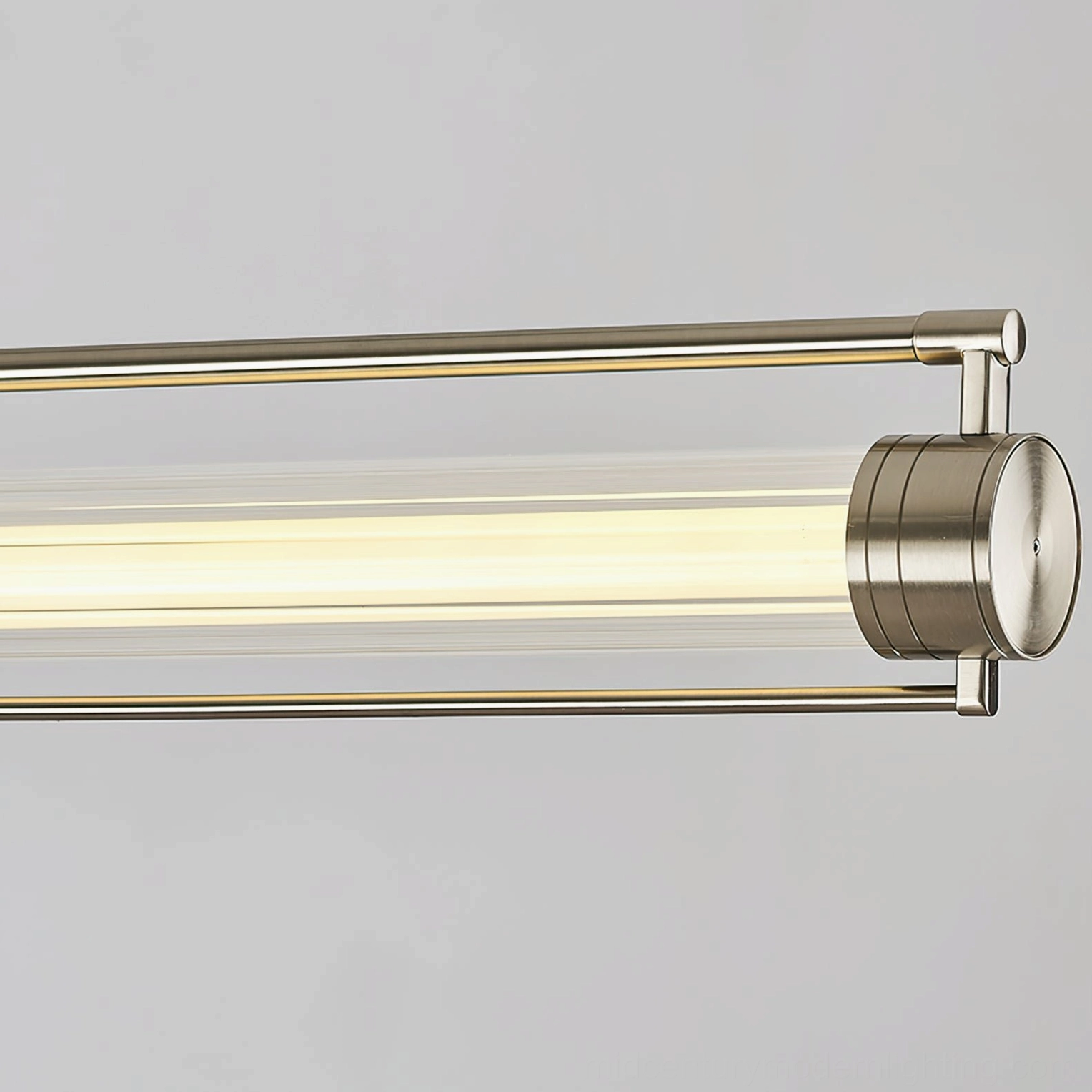 Close-up detail of Lirna linear LED chandelier showing brushed nickel end caps and ribbed glass shade