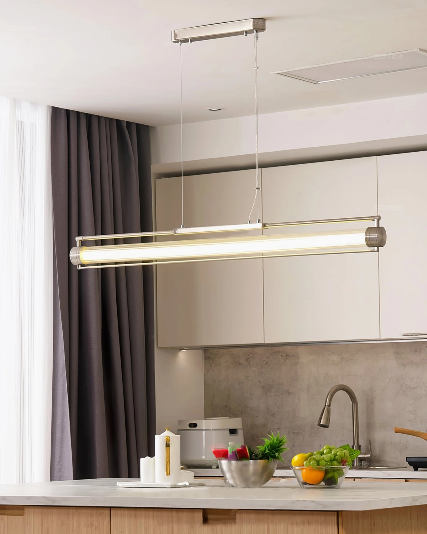 Lit Lirna LED pendant light fixture above kitchen island with warm illumination and dark curtains