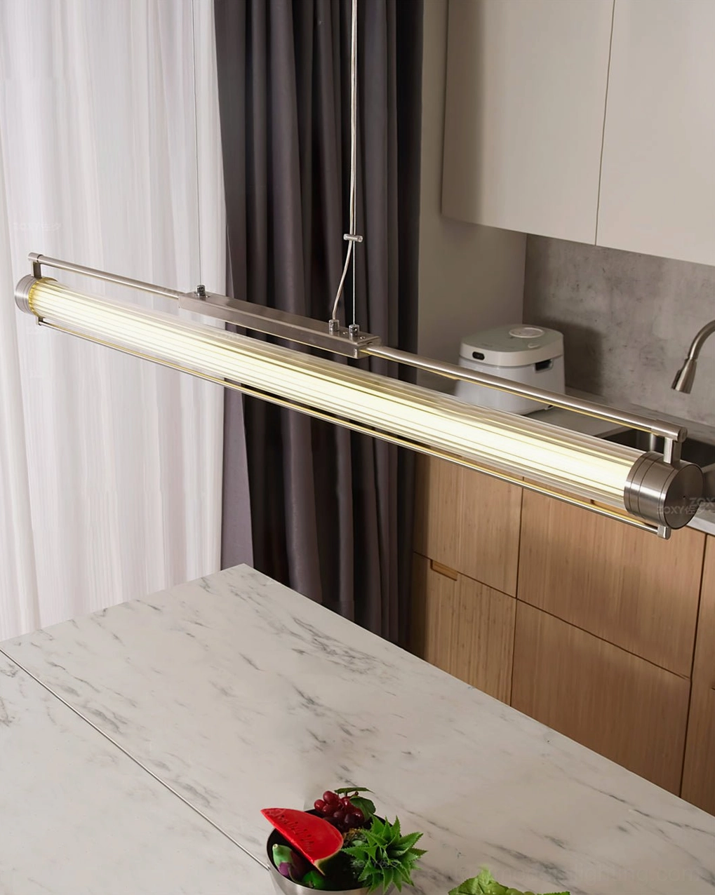 Lirna LED chandelier suspended over kitchen counter showing suspension hardware and mounting detail