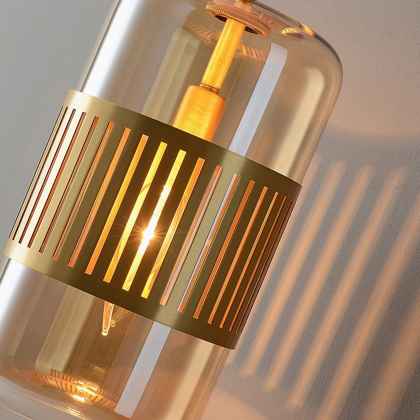 Lizak brass sconce with green glass detail, showcasing jewel-tone color option and sophisticated material selection