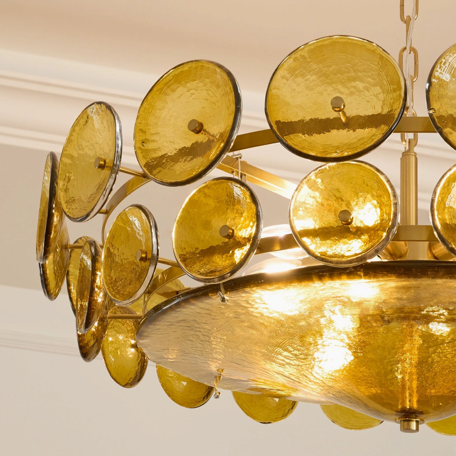 Lorenzo glass disc chandelier close-up of bronze metal frame and glass disc connection detail