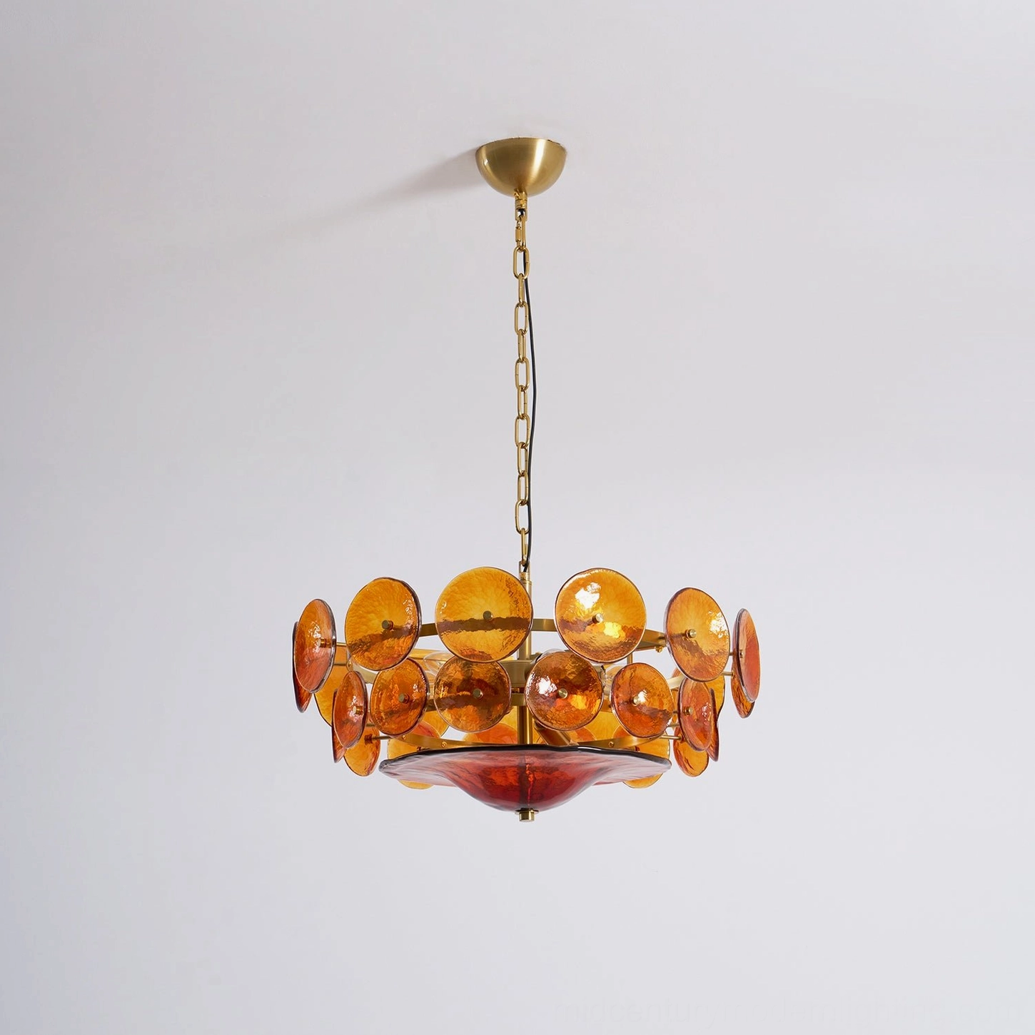 Sage green Lorenzo chandelier three-quarter view showing layered glass disc depth and dimension