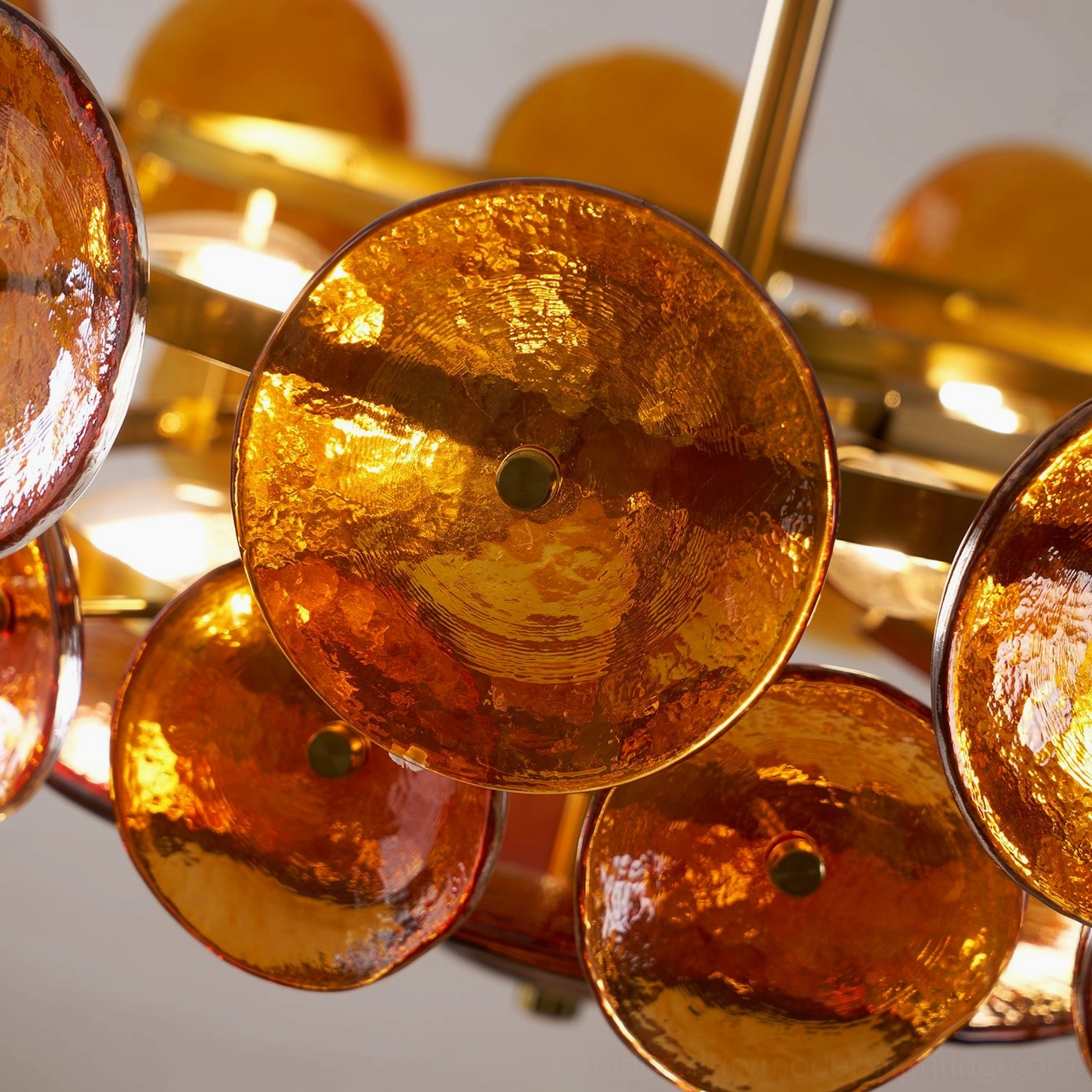 Lorenzo glass disc chandelier architectural detail of hand-shaped discs and precision geometry