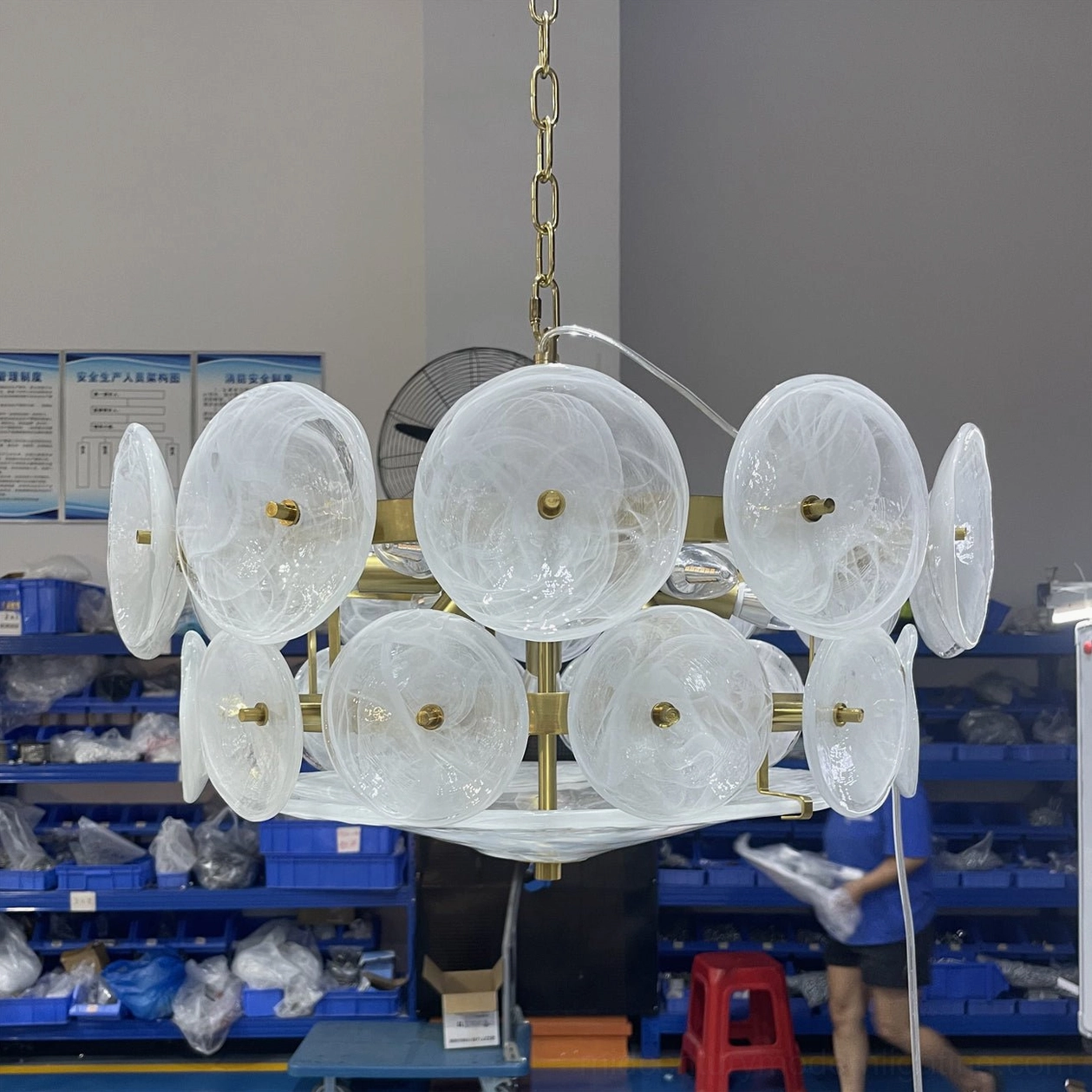 Lorenzo chandelier showing protective packaging and assembly guide for safe installation