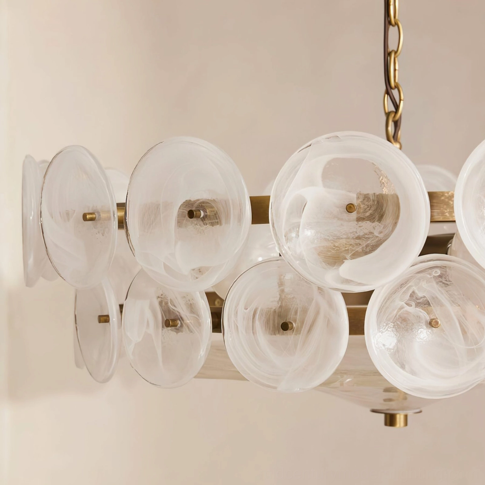 Sage green Lorenzo glass disc chandelier studio shot showing earthy mid-century colorway