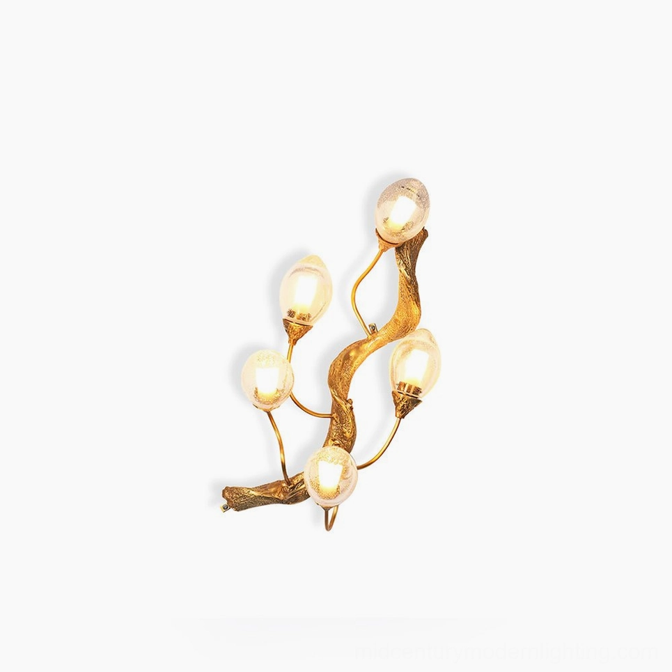 Lotus brass wall lamp elegant sculptural design with organic spiral form and warm lighting