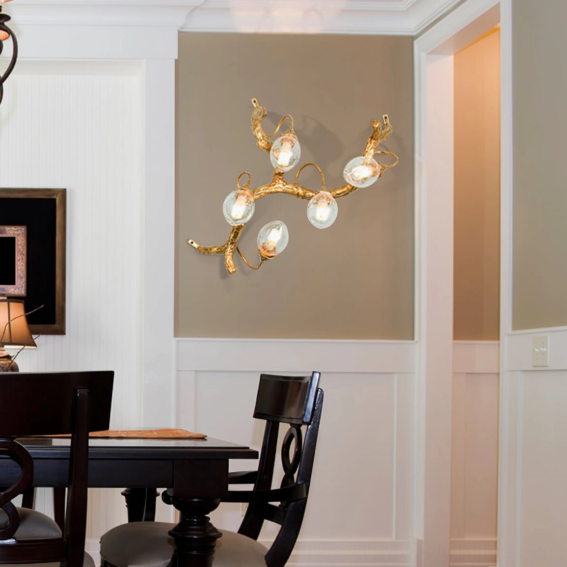 Lotus brass wall lamp sculptural form detail showing glass bulb capsules and brass patina
