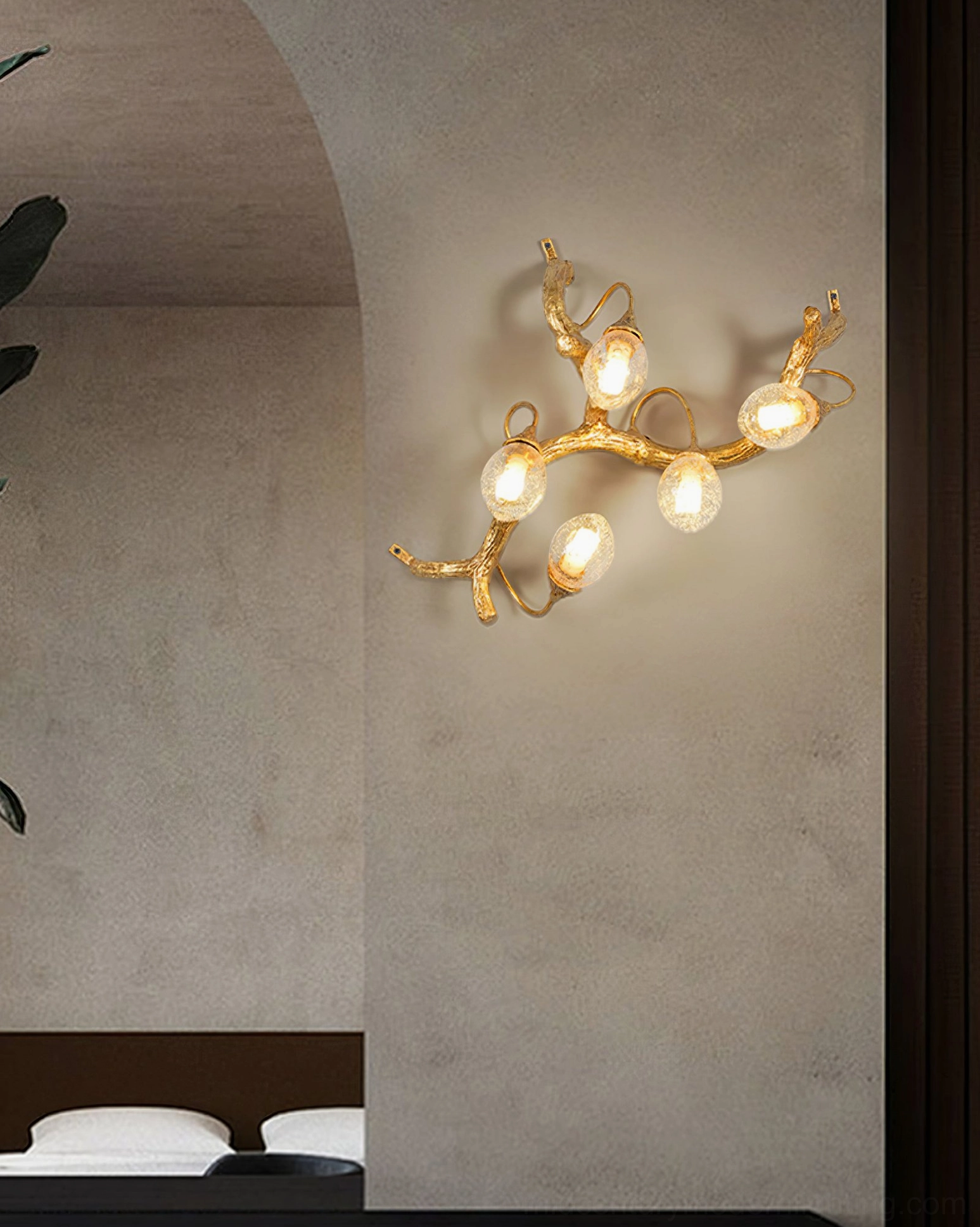 Lotus brass wall lamp with six bulb fixtures mounted on arched concrete accent wall