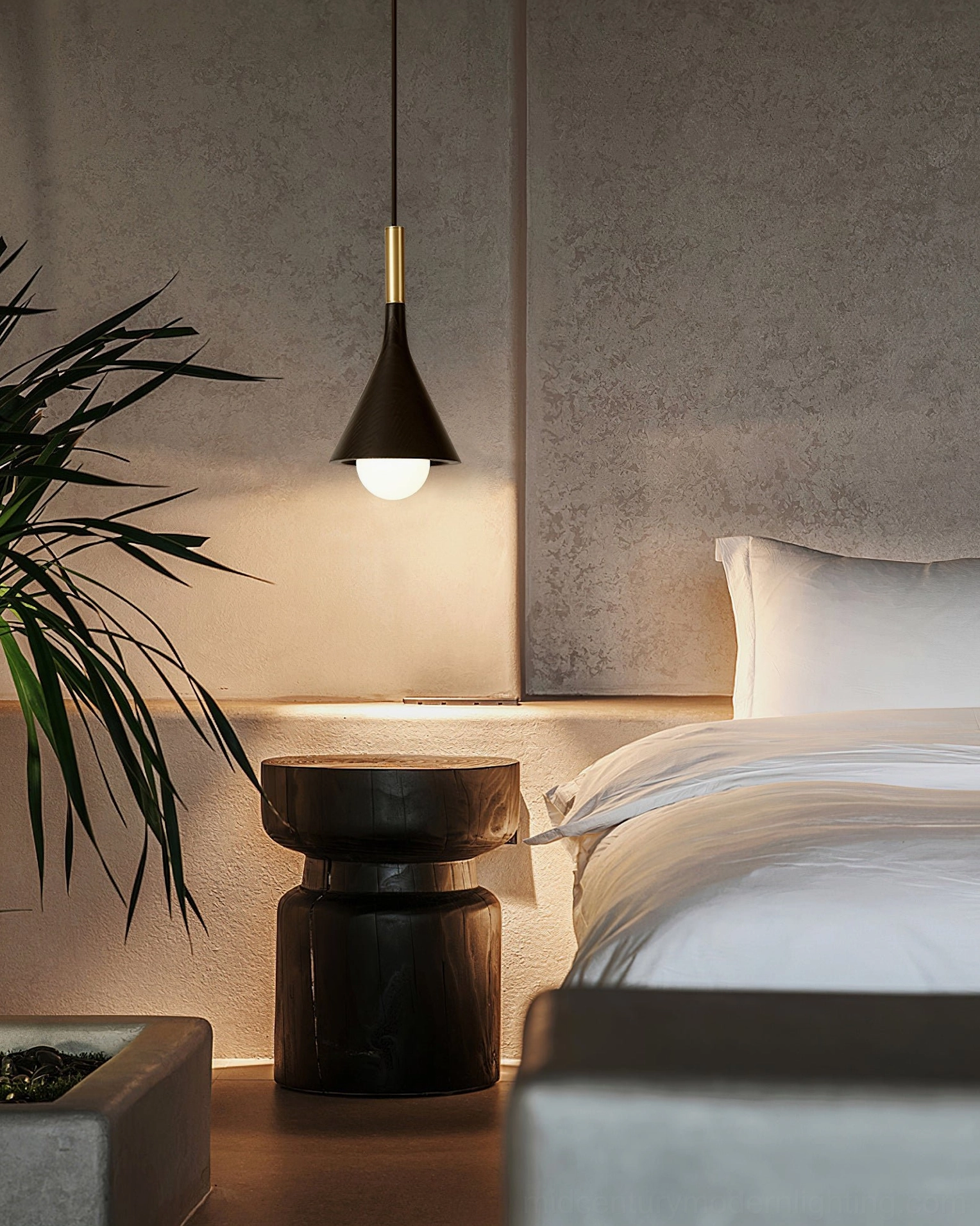 Lucian black and brass pendant light in modern master bedroom with ambient glow