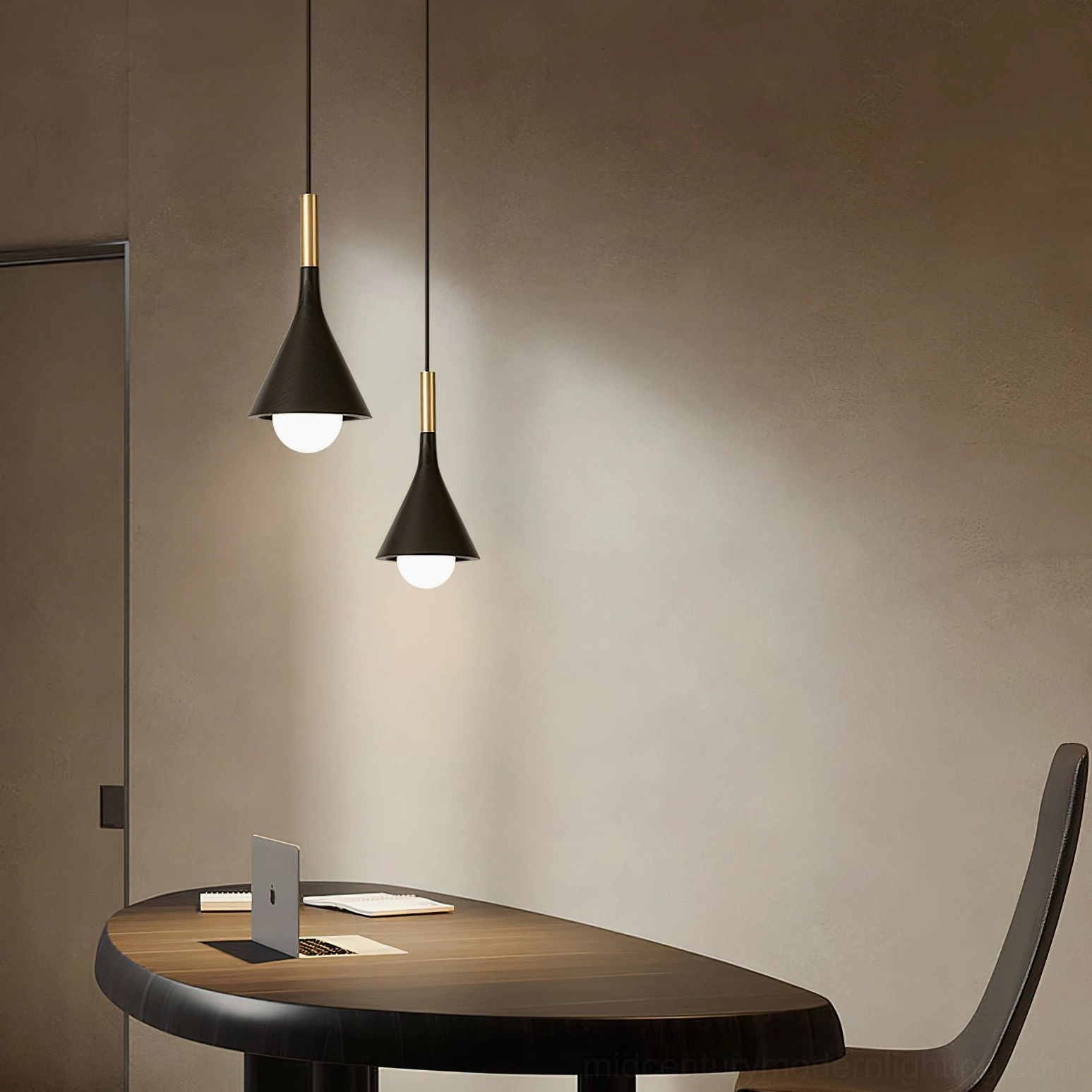 Lucian black pendant lamp in small home office nook with round wooden desk