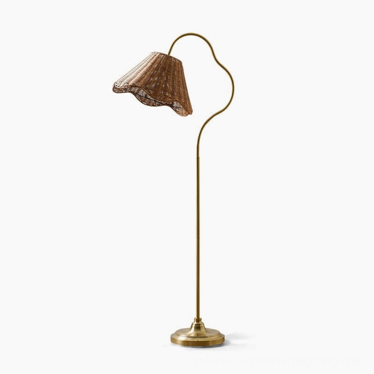 Lucinda arc floor lamp front low-angle studio view showcasing brass metal frame sculptural design