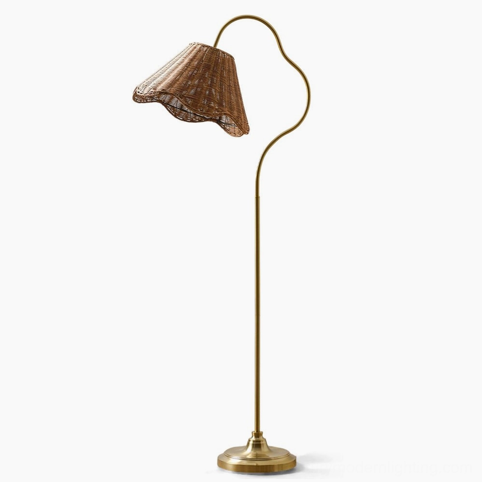 Lucinda hand-woven rattan arc floor lamp with antique brass frame and scalloped shade, studio front view