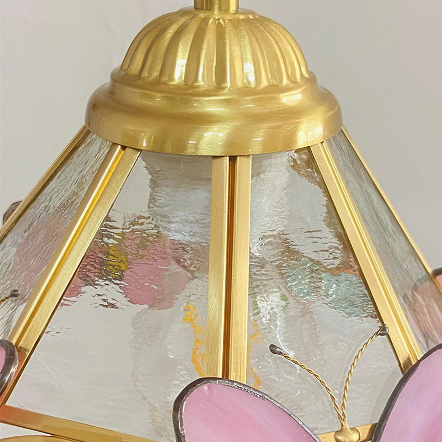 Brass Ceiling Fixture Detail of Lulla Butterfly Pendant with Ribbed Hardware and Water-Patterned Glass
