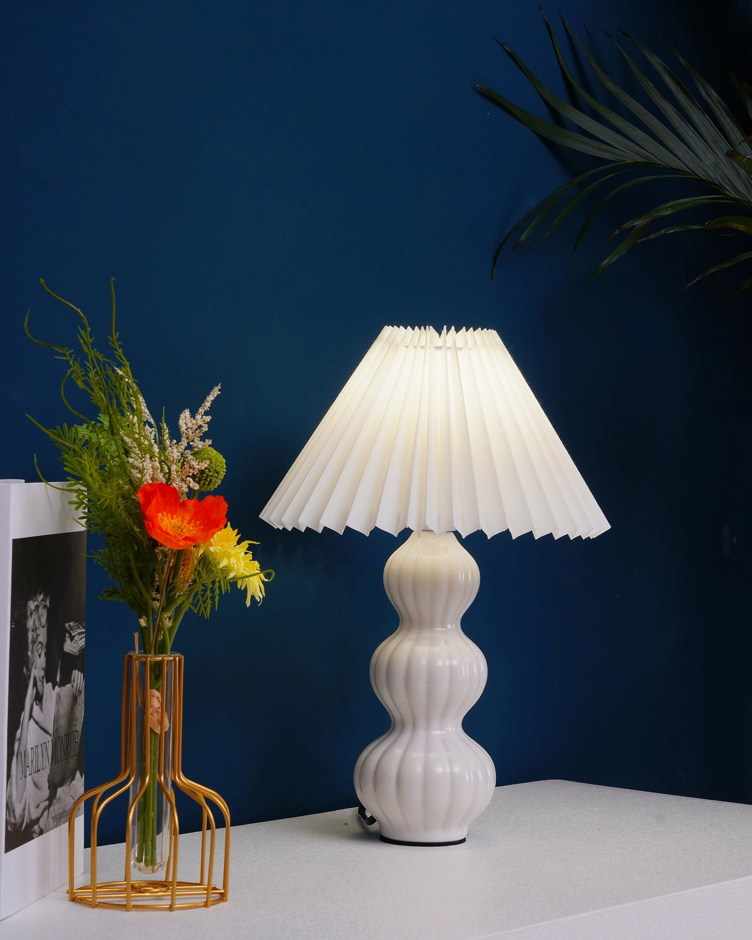Luna pleated table lamp ambient lighting effect, warm glow atmosphere creation in modern bedroom