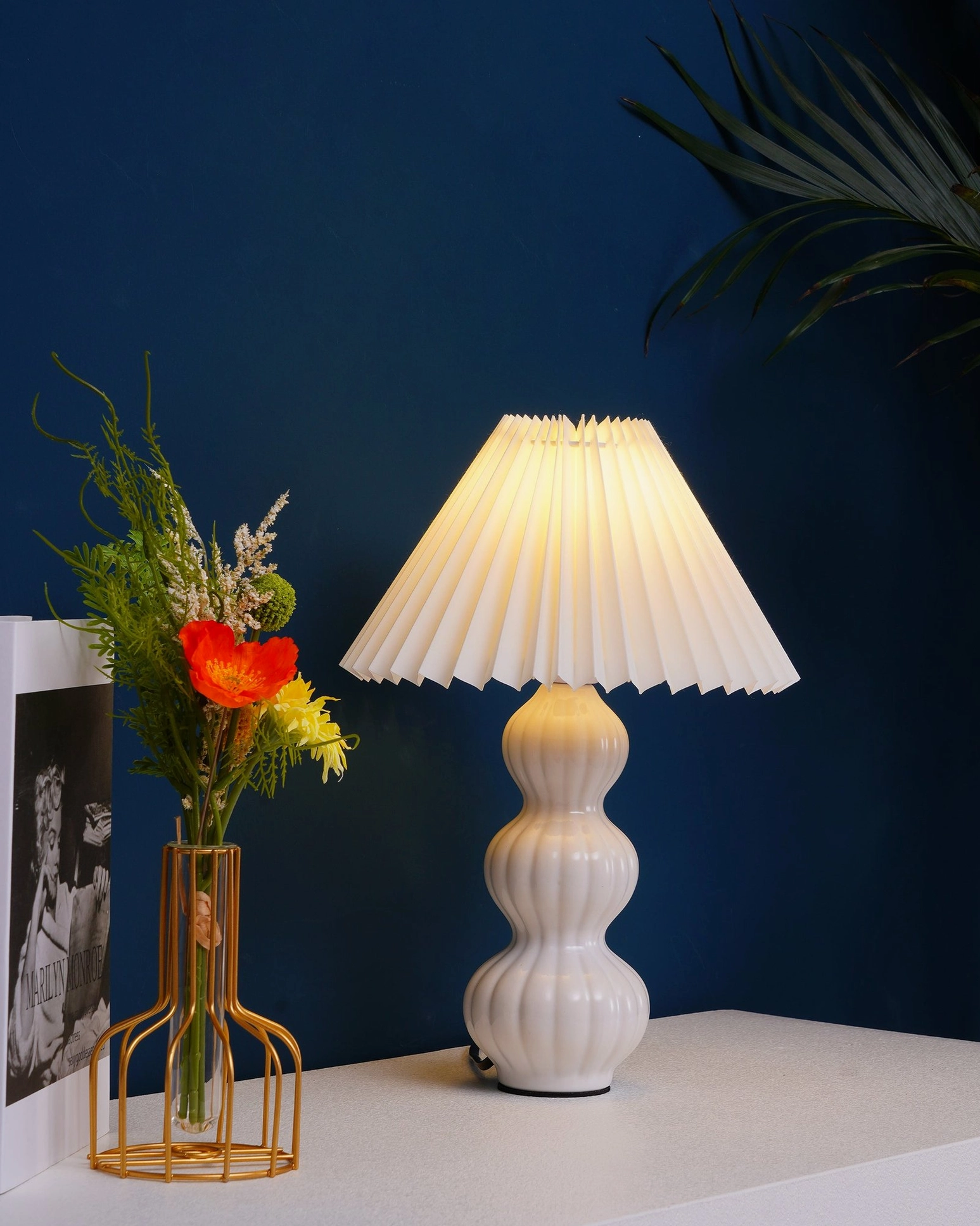Luna pleated table lamp with decorative styling elements, design-forward collectors aesthetic presentation