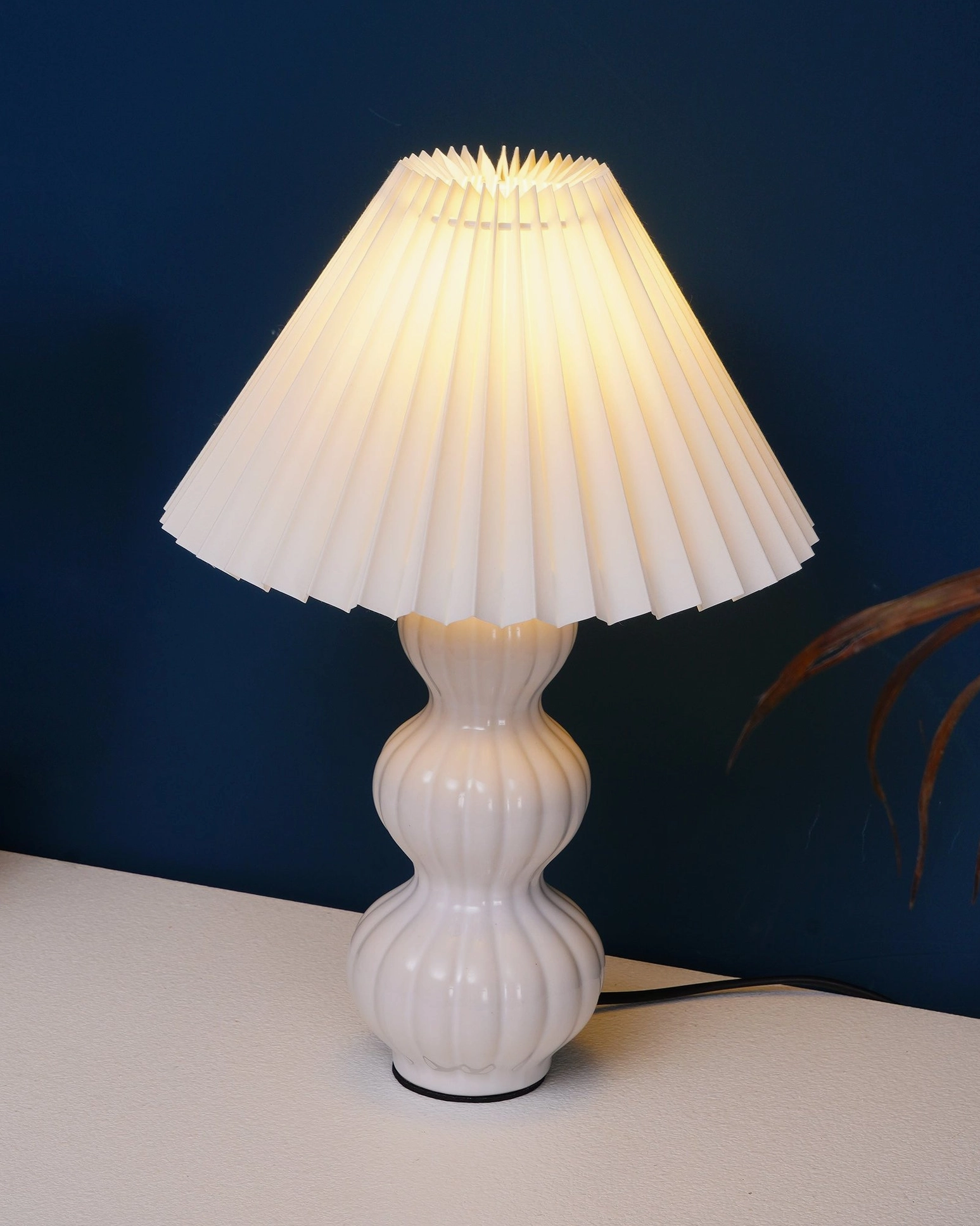 Luna pleated table lamp tabletop arrangement, layered lighting design with ambient and accent illumination