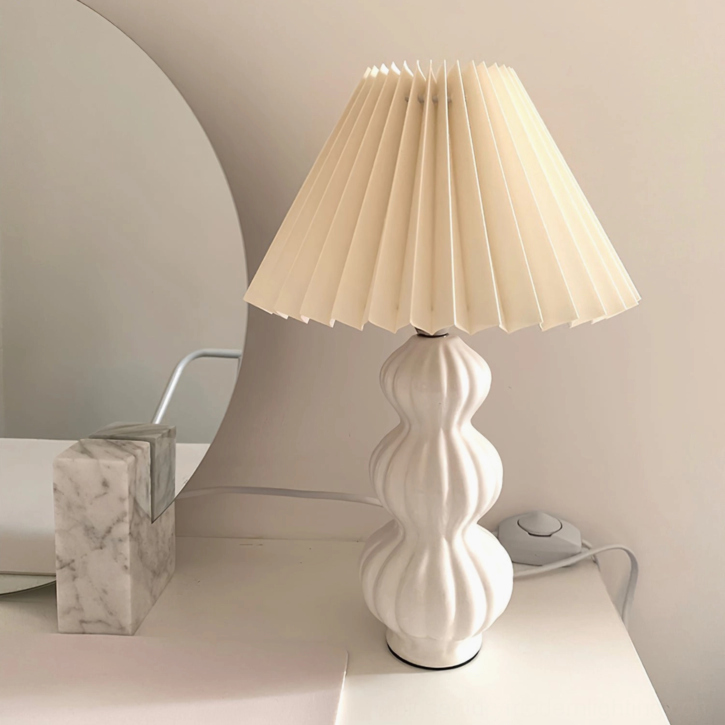 Luna pleated table lamp with LED bulb, energy-efficient warm white light emission through fabric shade