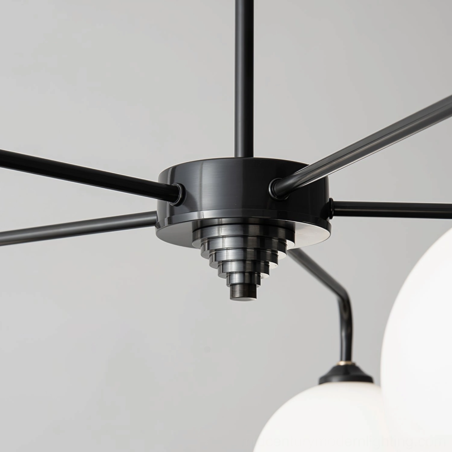 Architectural view of Lune globe chandelier showing symmetrical orb arrangement and metal armature design