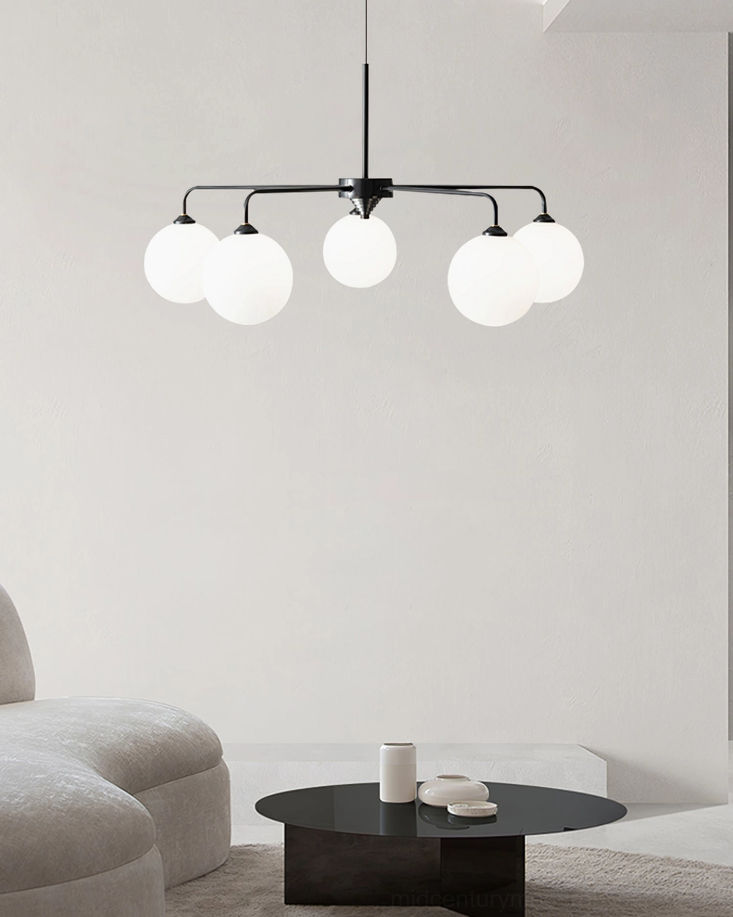 Black metal frame Lune chandelier with spherical frosted glass globes in Nordic minimalist sectional living room