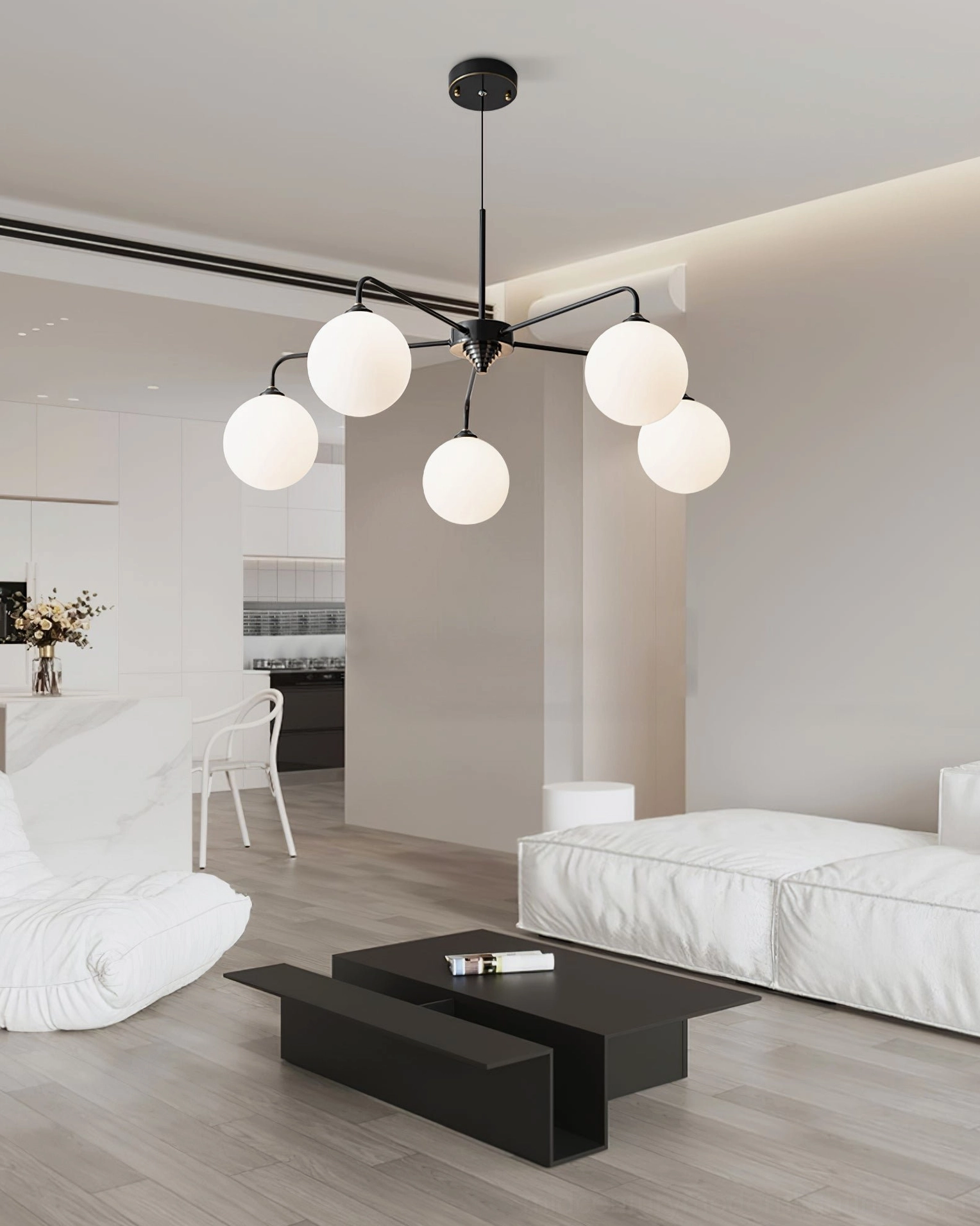 Gold and white Lune chandelier with frosted glass shades suspended in light luxury modern living room