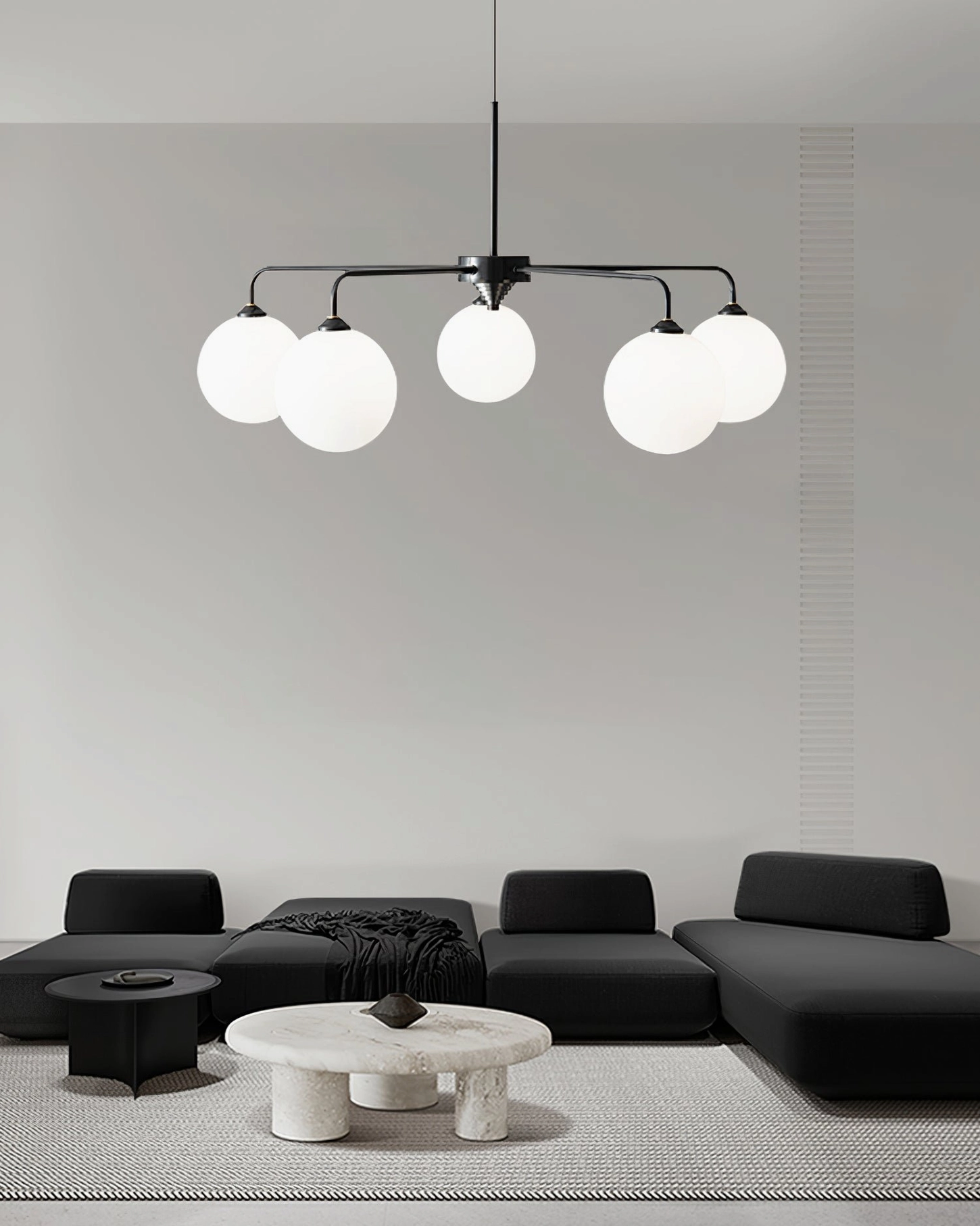 Black metal frosted glass 5-head globe chandelier in open-concept living space with Nordic minimalist style