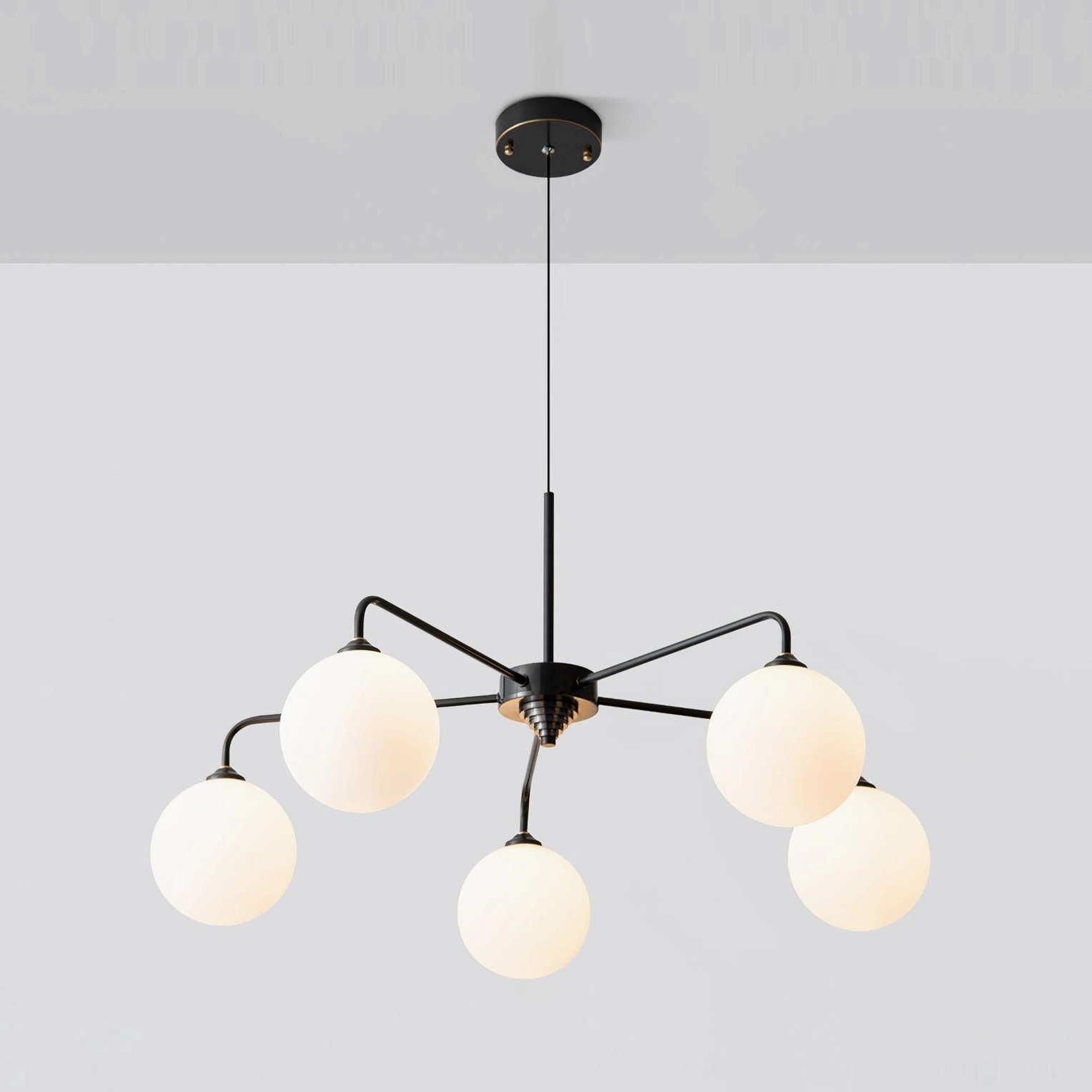 Overhead view of Lune 5-light globe pendant fixture with matte black metal framework and frosted glass orbs