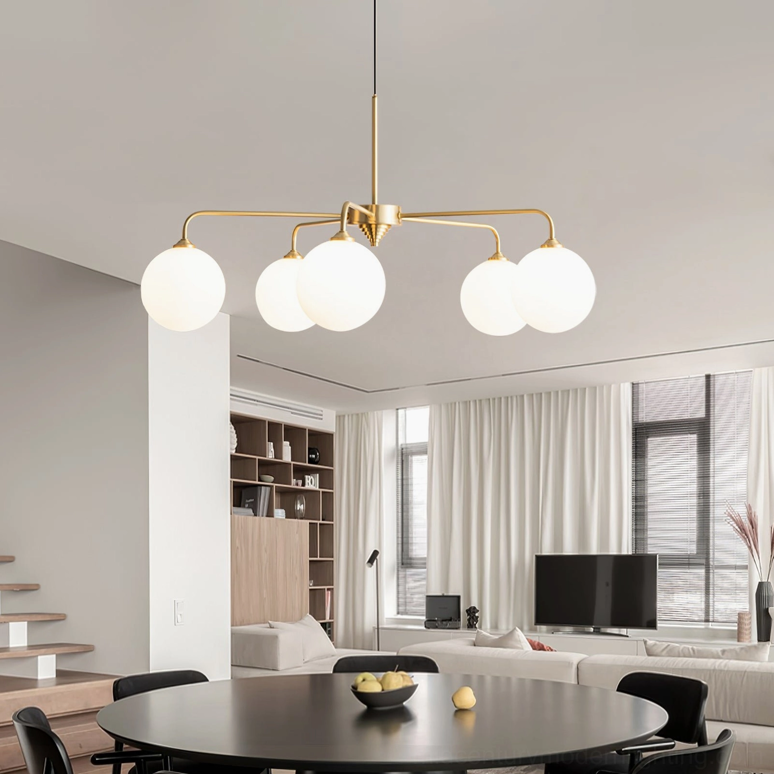 Lune pendant fixture showcasing sculptural balance between brass framework and spherical glass elements