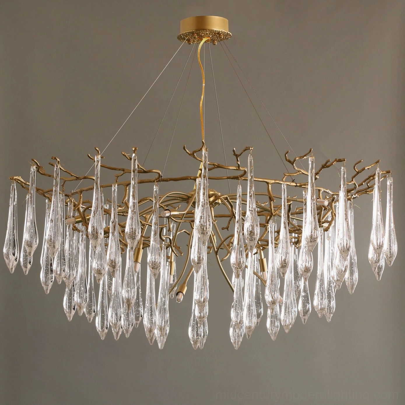Luxury brass branch chandelier installation showing ceiling mount and decorative canopy detail