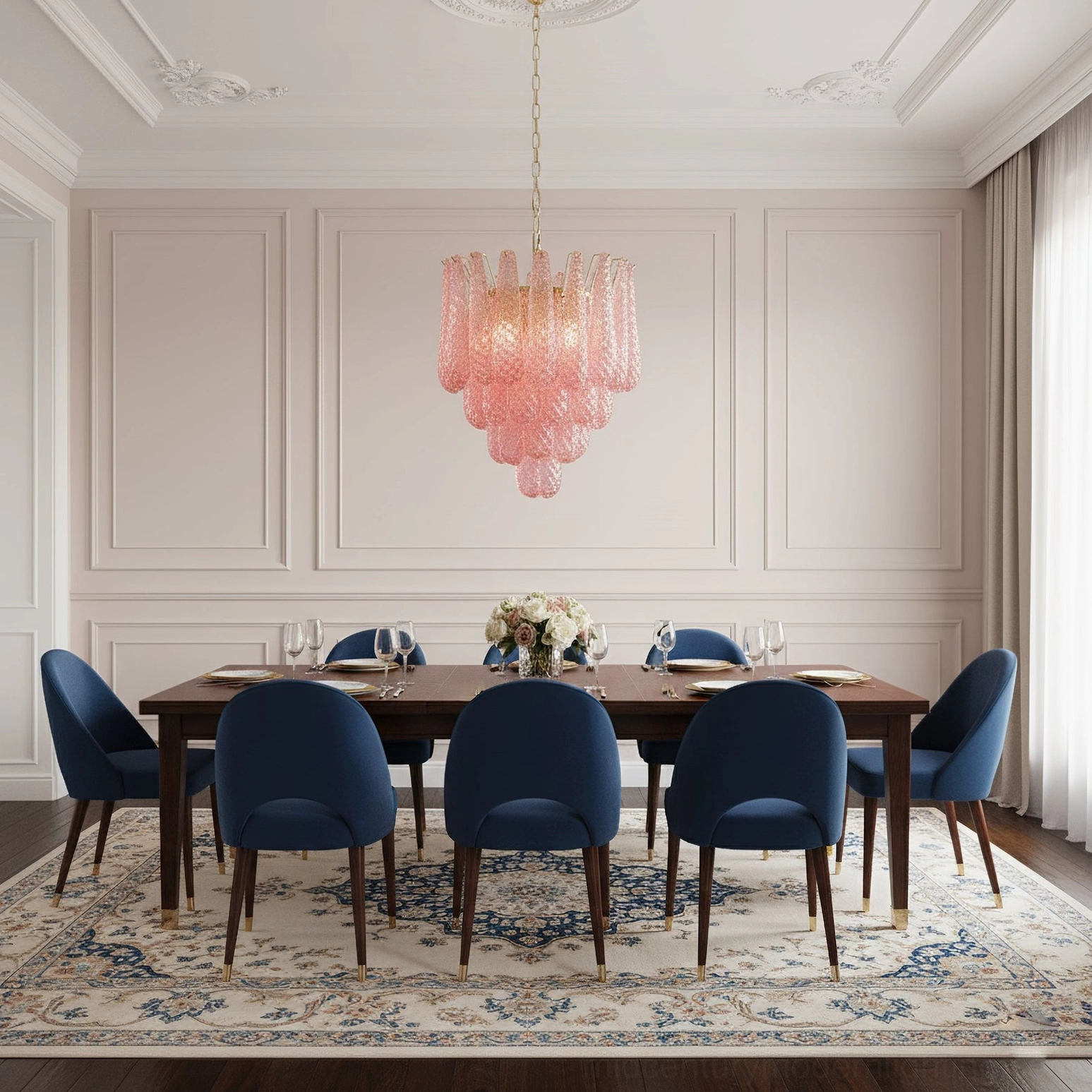 Pink hand-blown glass chandelier in luxury traditional dining room with navy chairs and dark wood table