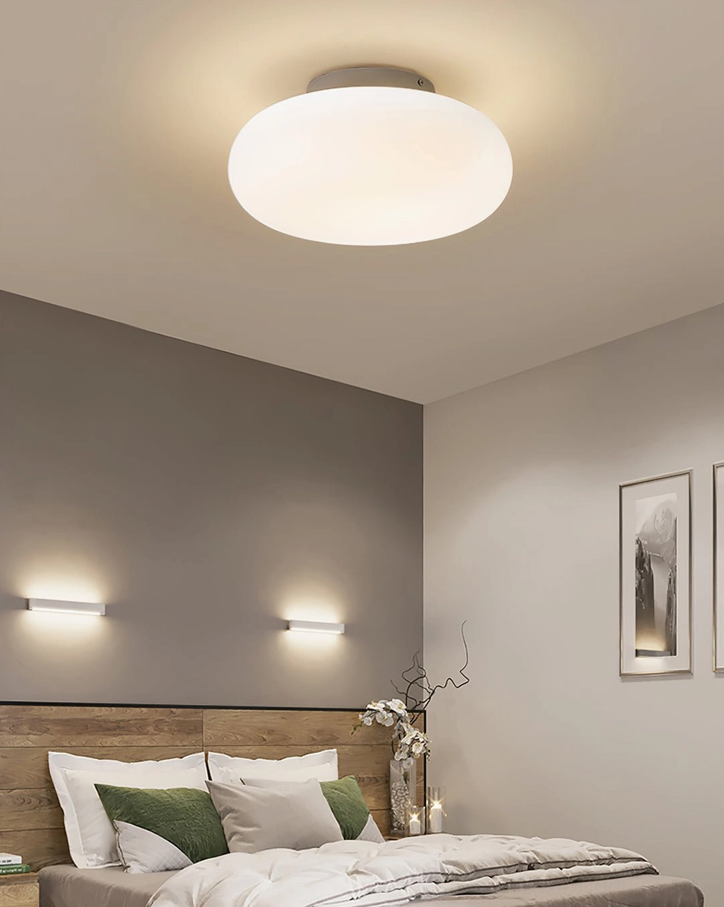 Maga ceiling fixture in modern bedroom with accent wall and wall sconces, cozy contemporary style