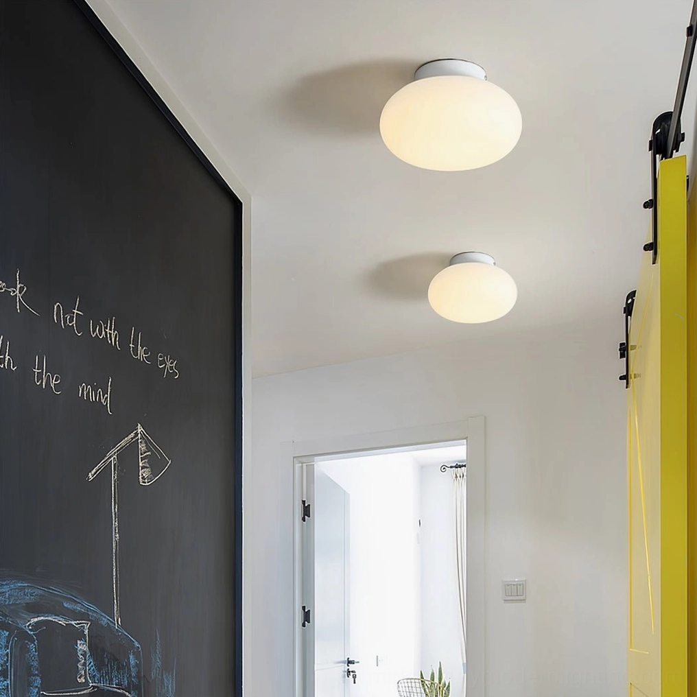Maga flush mount ceiling light in contemporary home creating even diffused ambient light