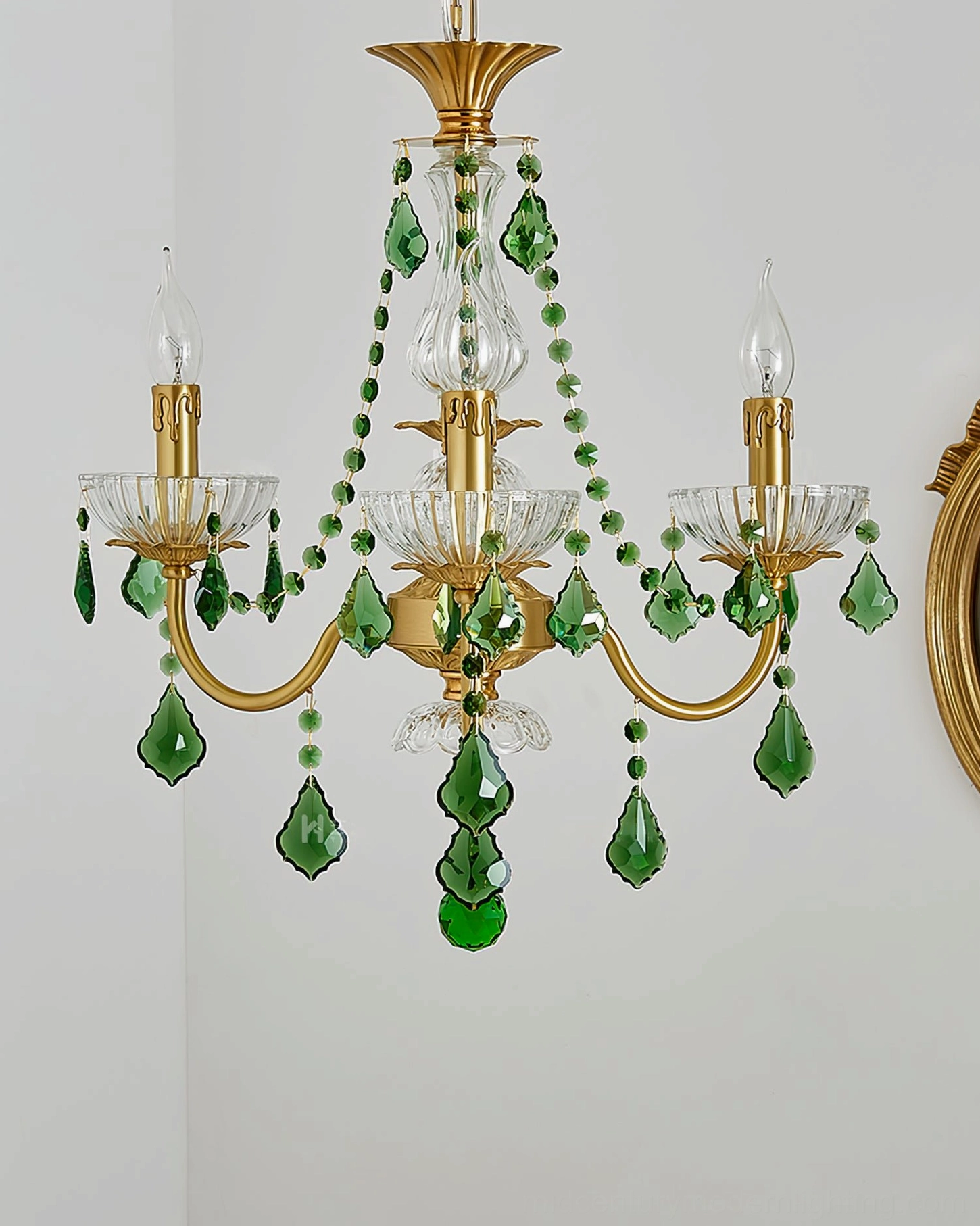 Magdalena brass and emerald crystal chandelier detail view of glass crystal refraction