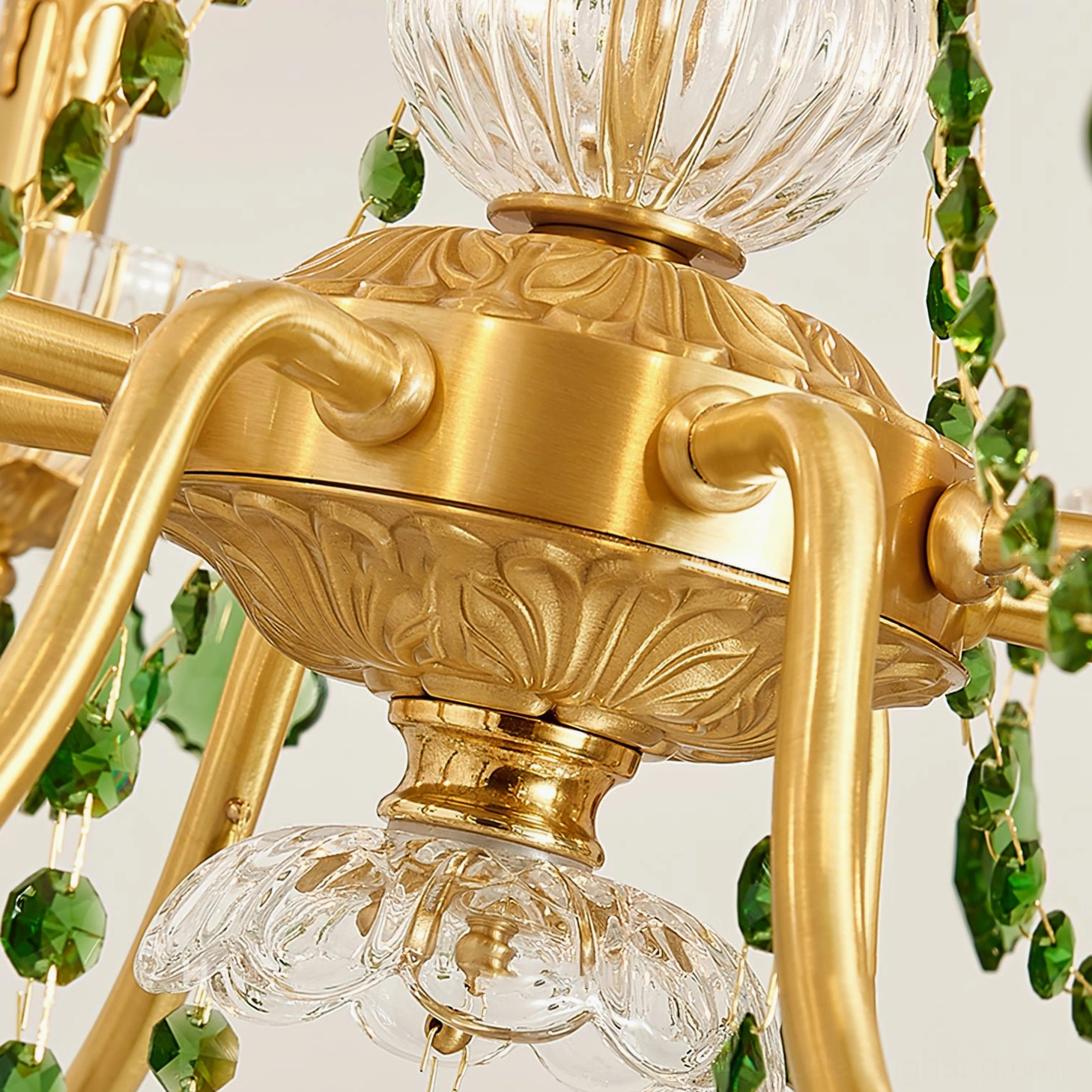 Top-down view of Magdalena brass chandelier embossed gold metal canopy hardware