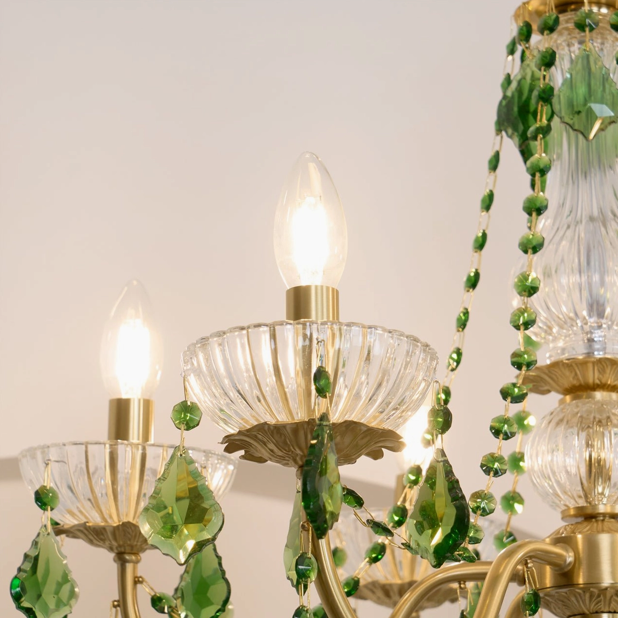 Magdalena mid-century chandelier showcasing vintage brass and emerald crystal aesthetic