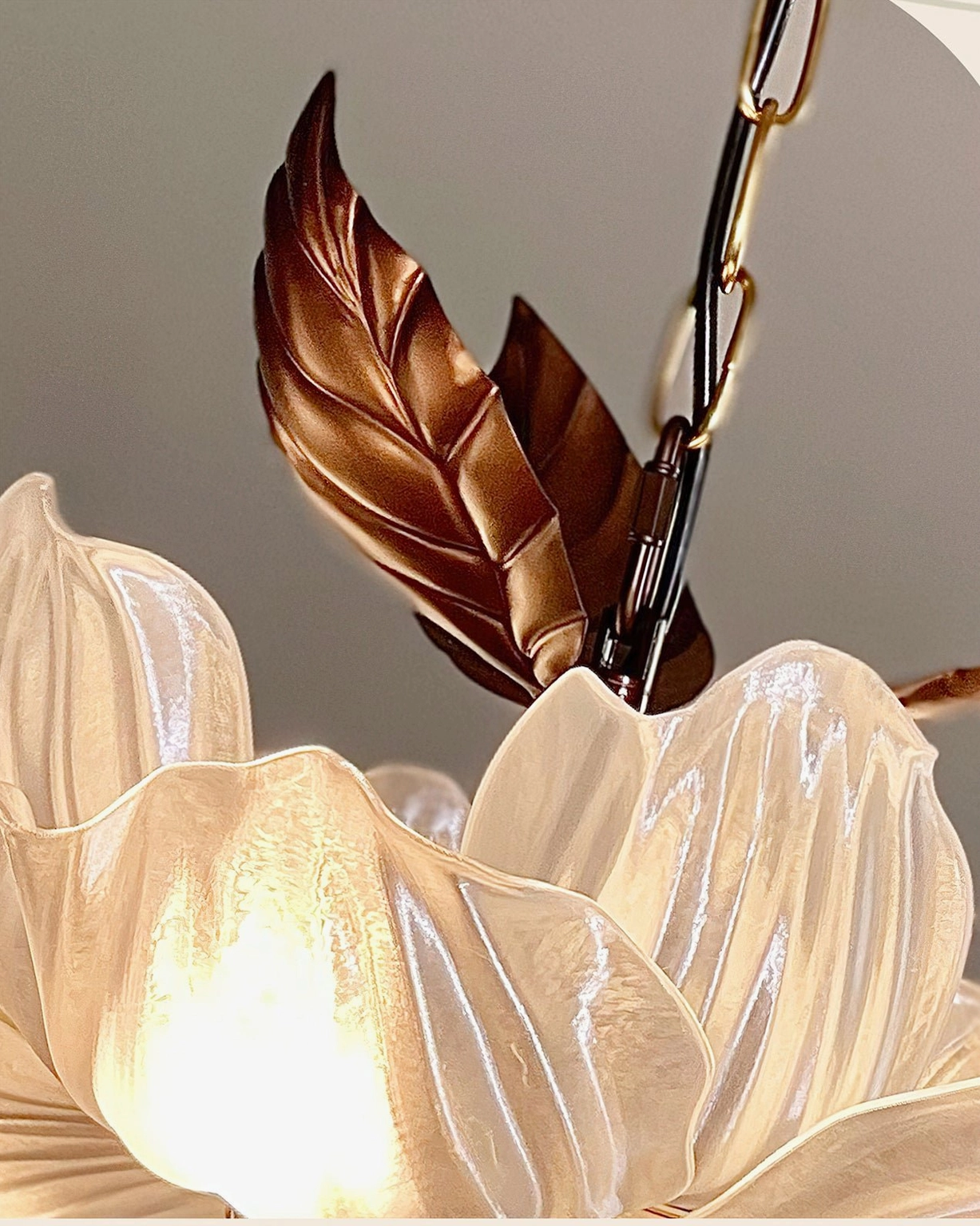 Magnolia Bloom Chandelier upward angle view of bronze canopy and hand-linked suspension chain