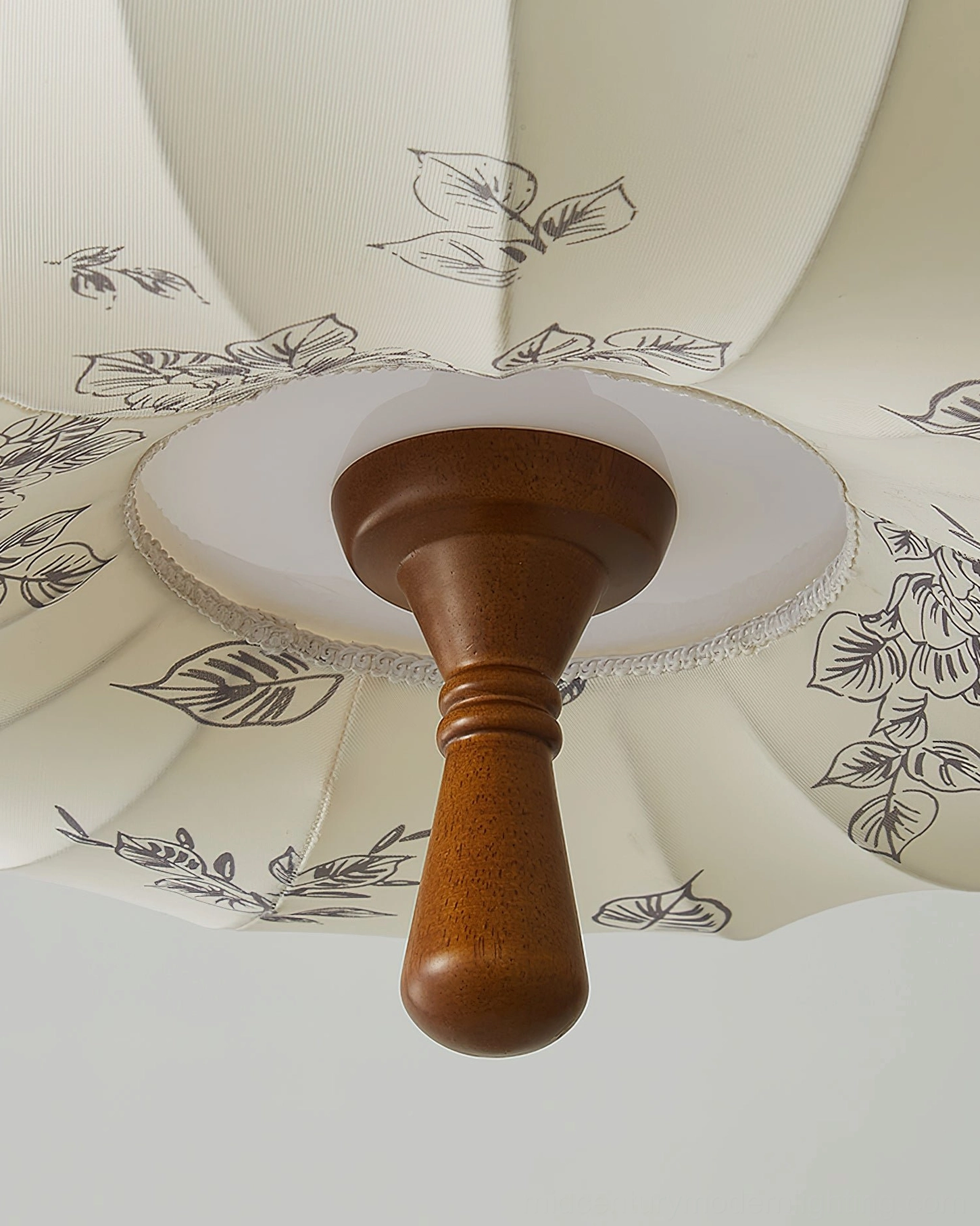 Mantis pumpkin ceiling lamp with gold metal frame and walnut wood accents on white studio background